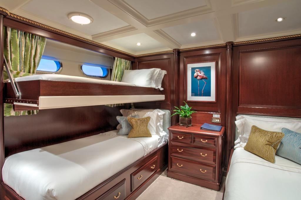 a room with a bed and a window aboard TELEOST Yacht for Charter