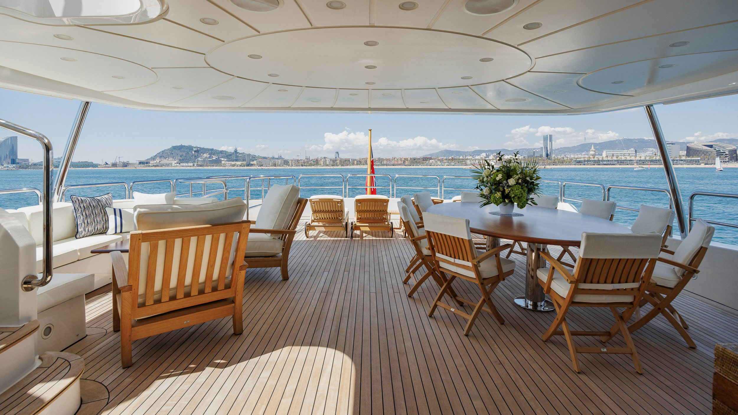 a room with tables and chairs aboard BUNTY Yacht for Sale