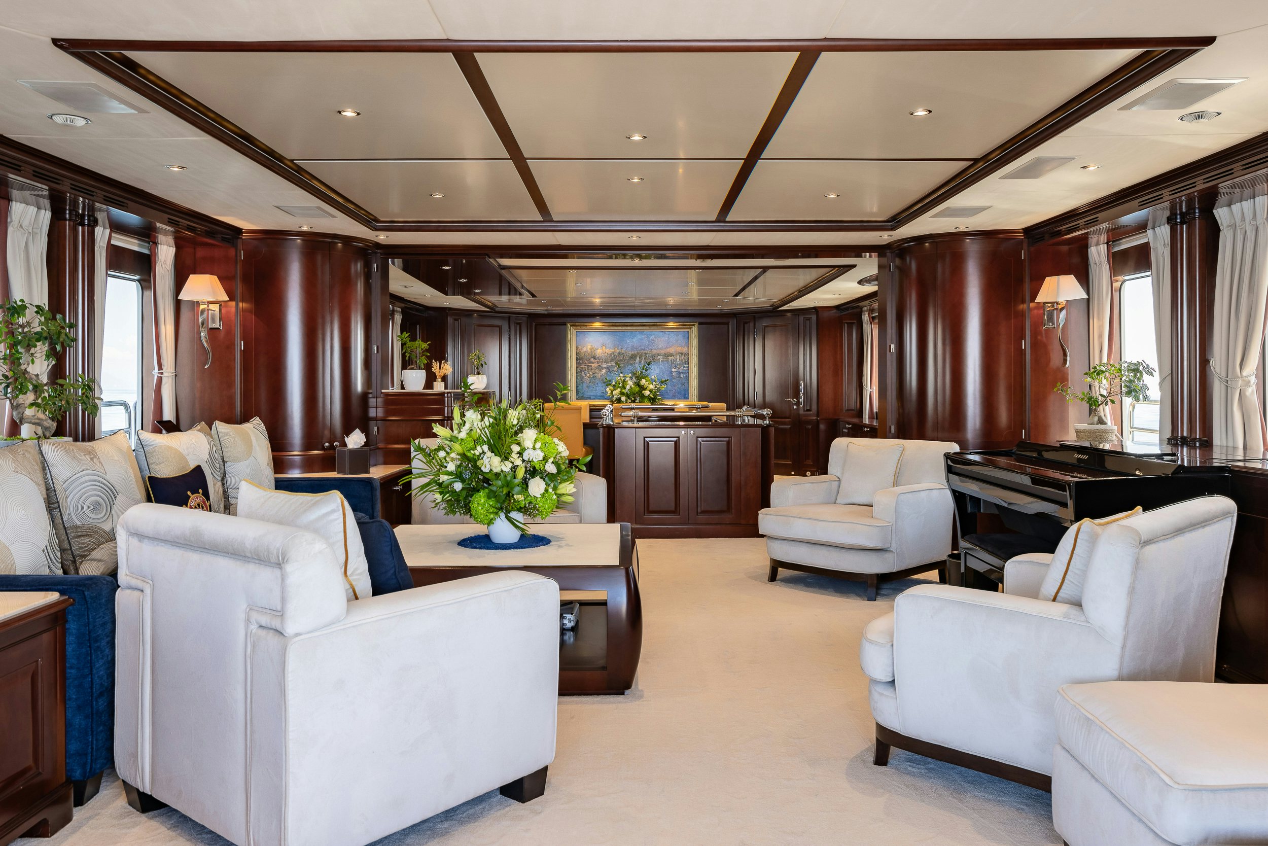 a large living room with a piano aboard BUNTY Yacht for Sale