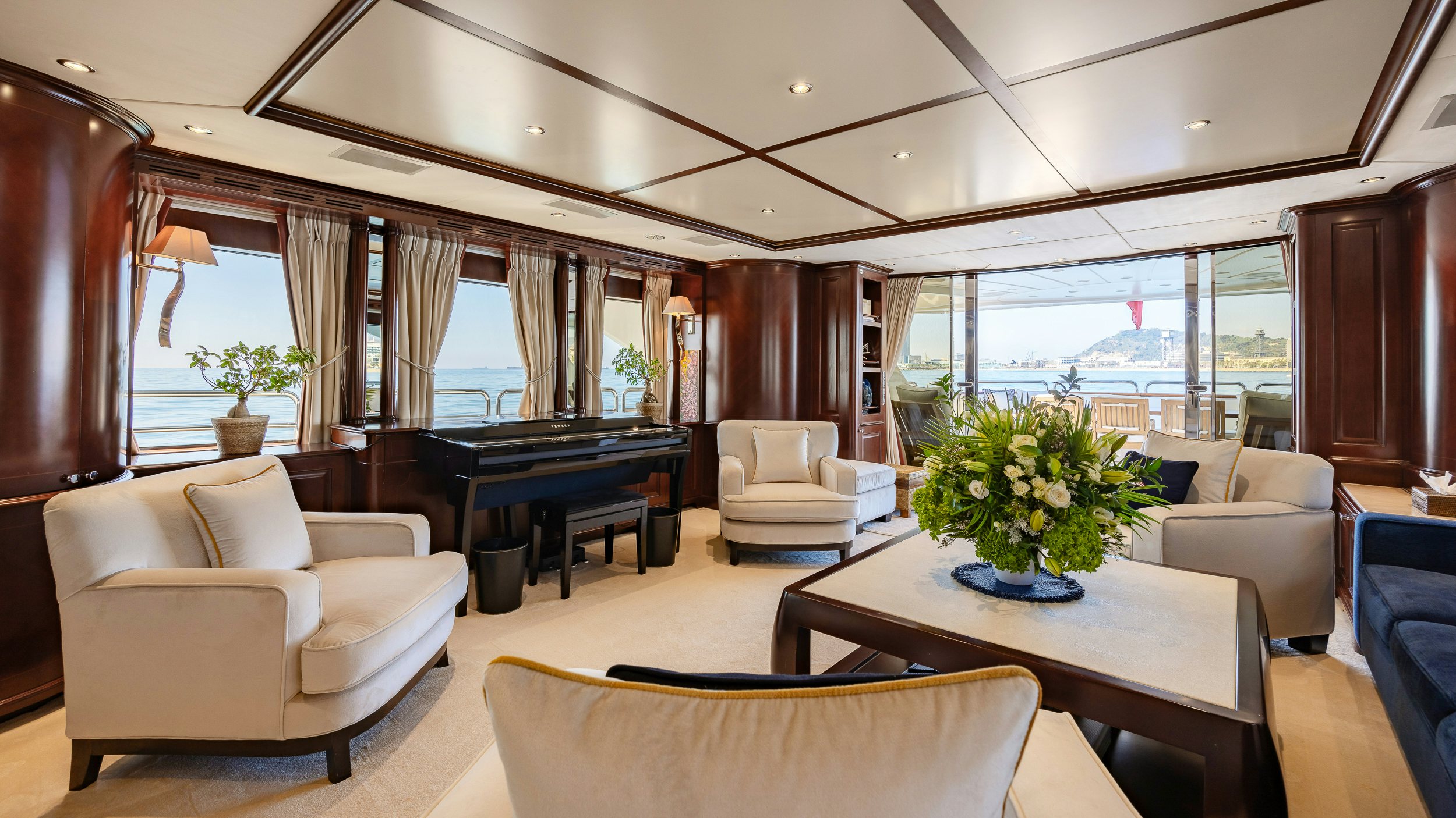 a living room with a table and chairs aboard BUNTY Yacht for Sale
