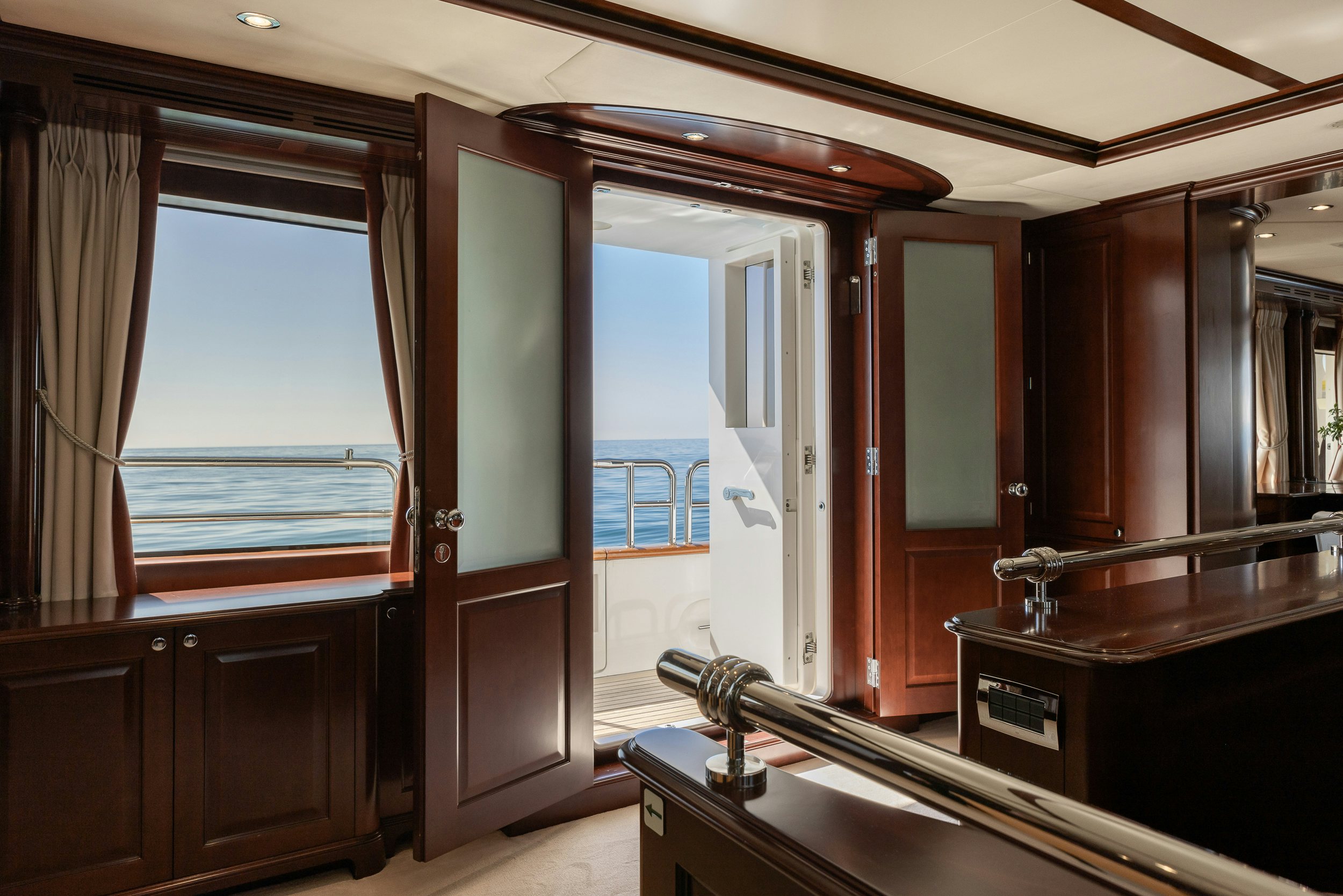 a room with a door and cabinets aboard BUNTY Yacht for Sale