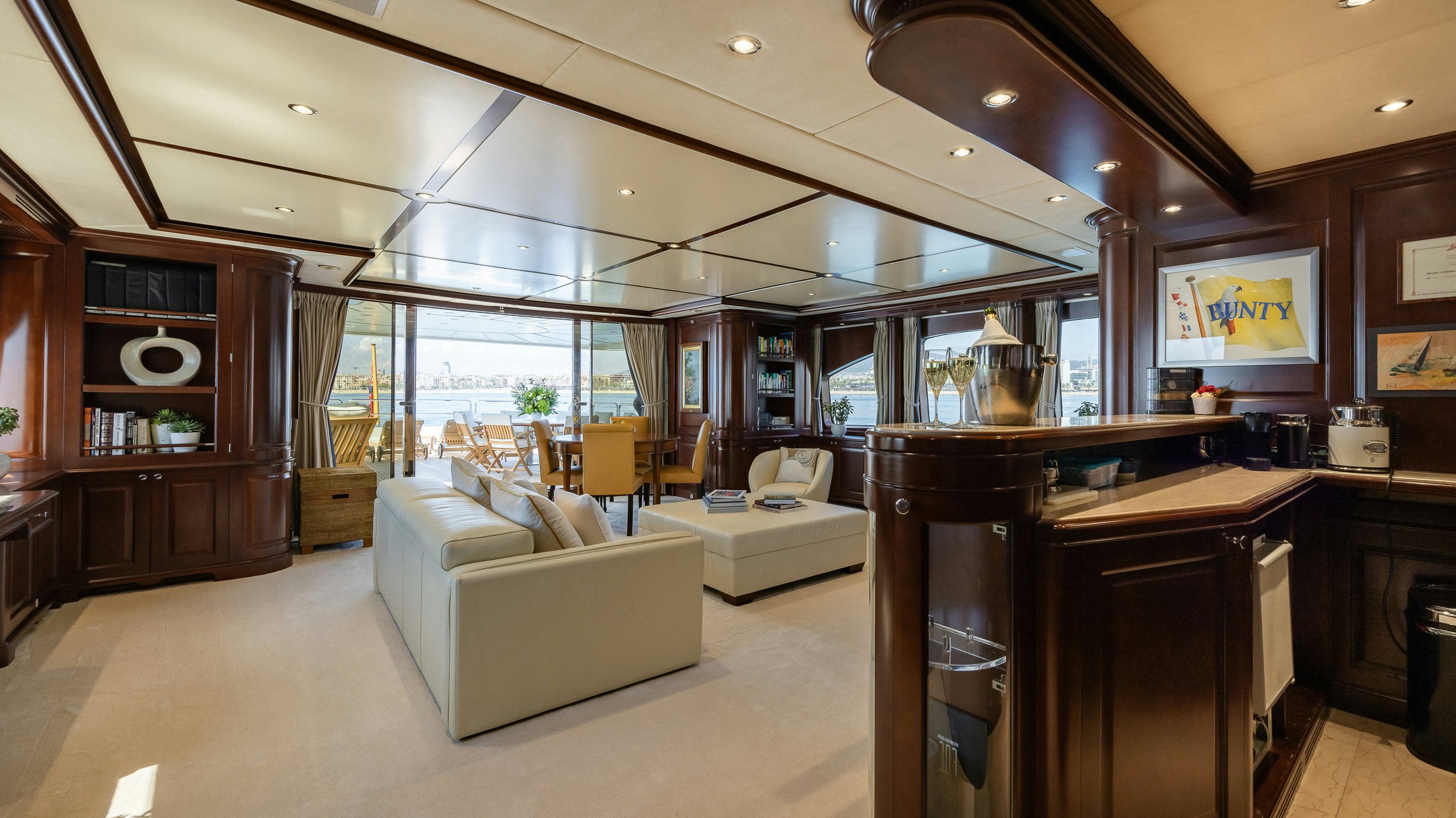 a living room with a couch and a table aboard BUNTY Yacht for Sale