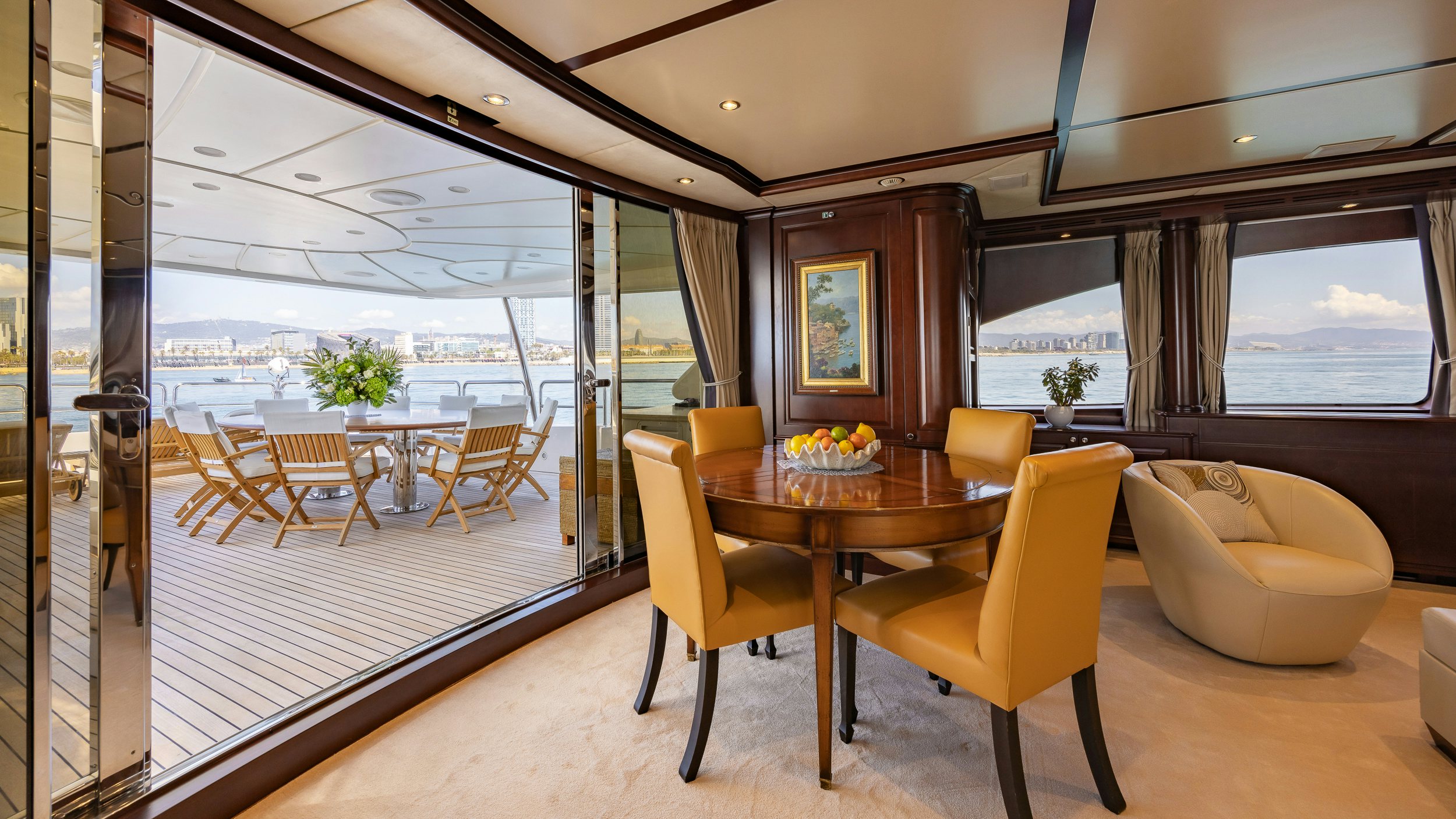 a room with a table and chairs aboard BUNTY Yacht for Sale