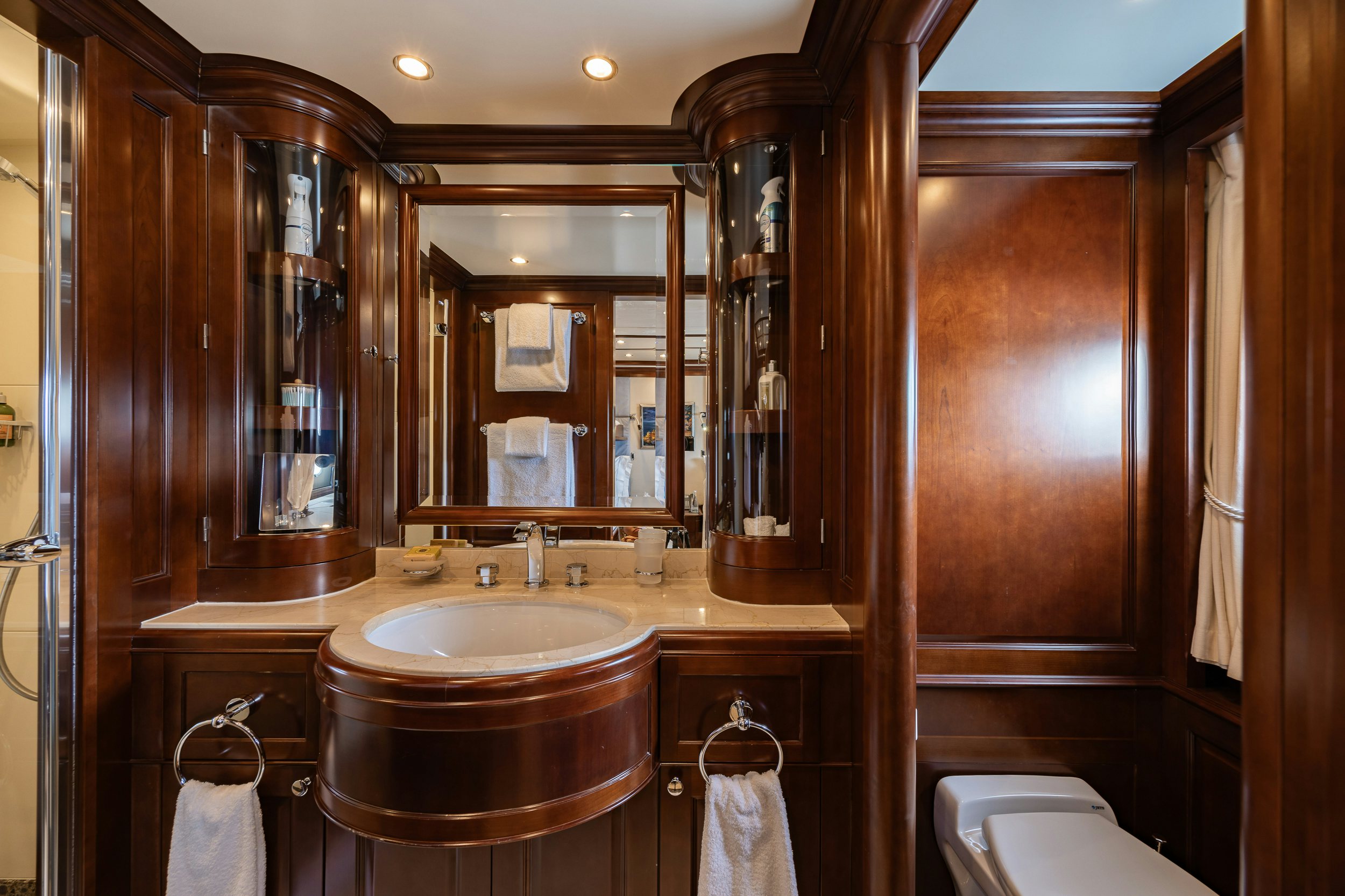 a bathroom with a large mirror aboard BUNTY Yacht for Sale