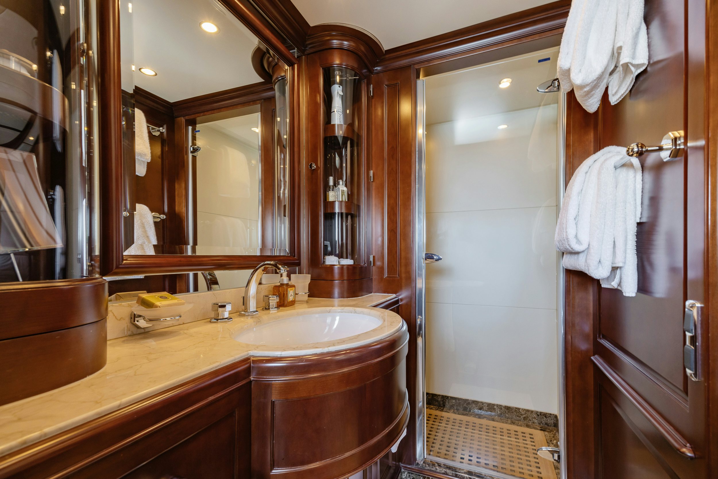a bathroom with a sink and a mirror aboard BUNTY Yacht for Sale
