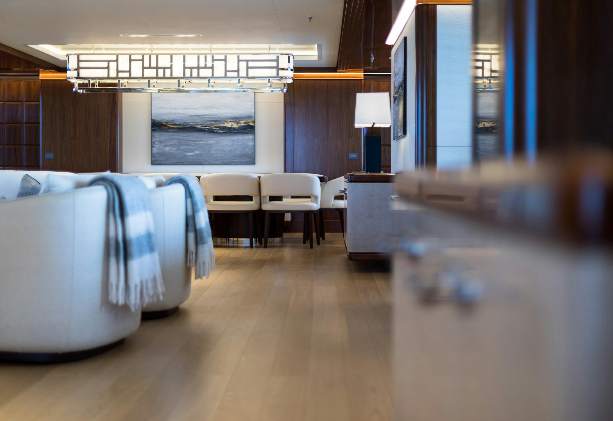a room with a bed and a couch aboard CALEX Yacht for Charter