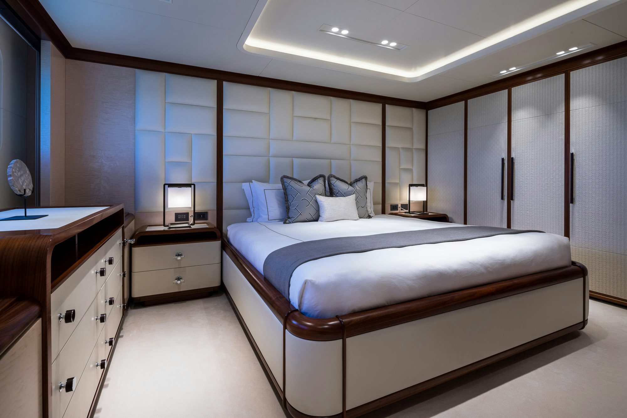 a bedroom with a bed aboard CALEX Yacht for Charter