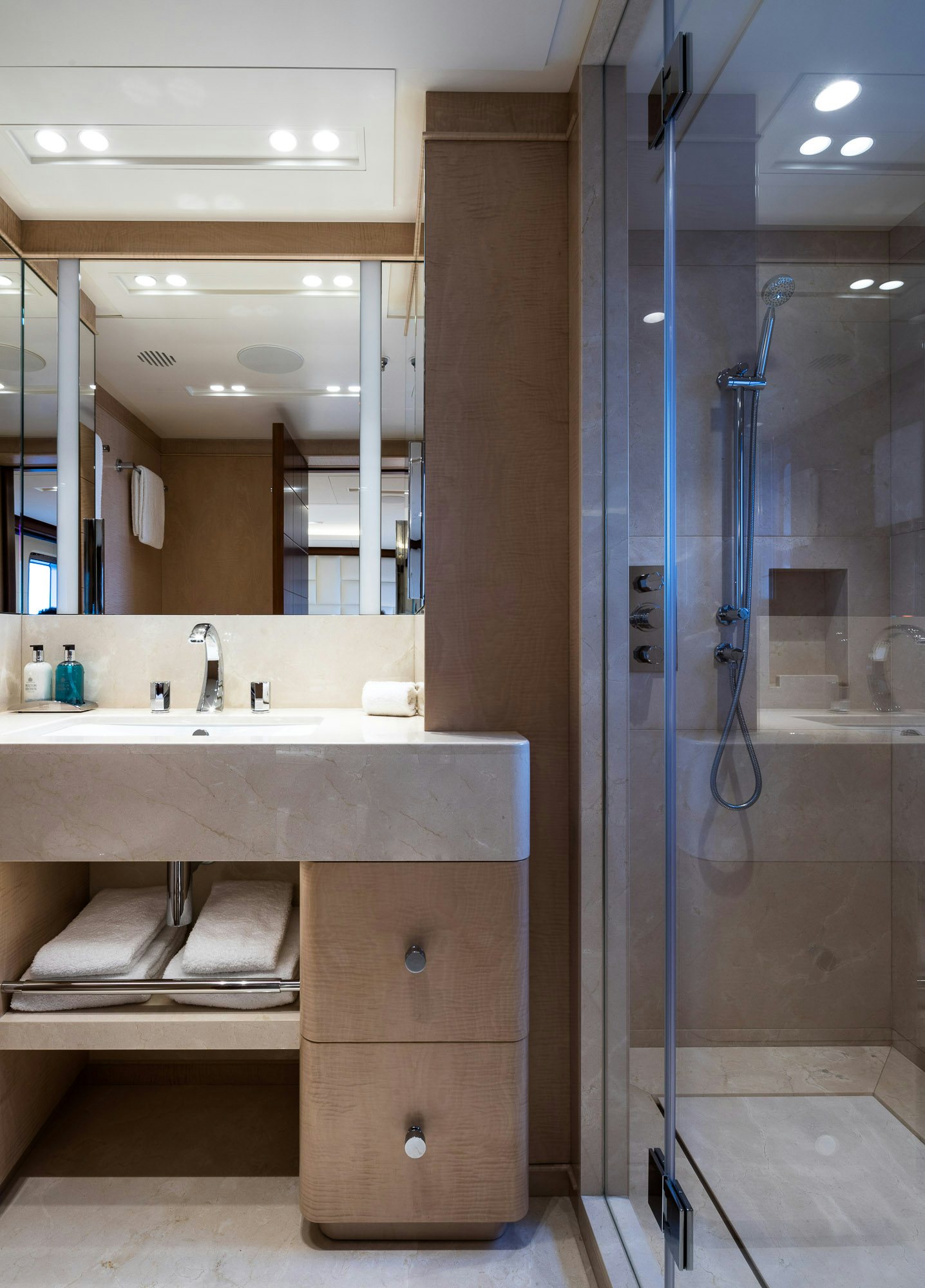 a bathroom with a sink and a mirror aboard CALEX Yacht for Charter