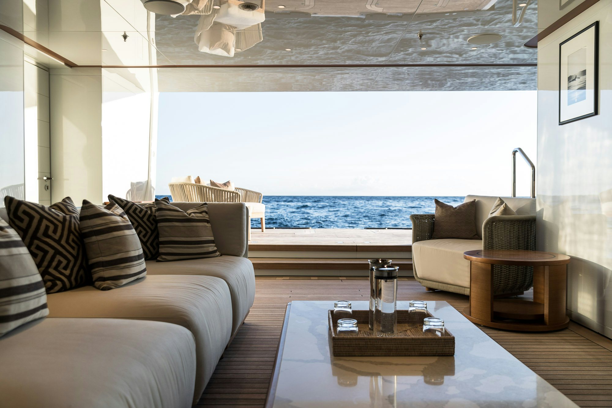 a living room with a large window aboard CALEX Yacht for Charter