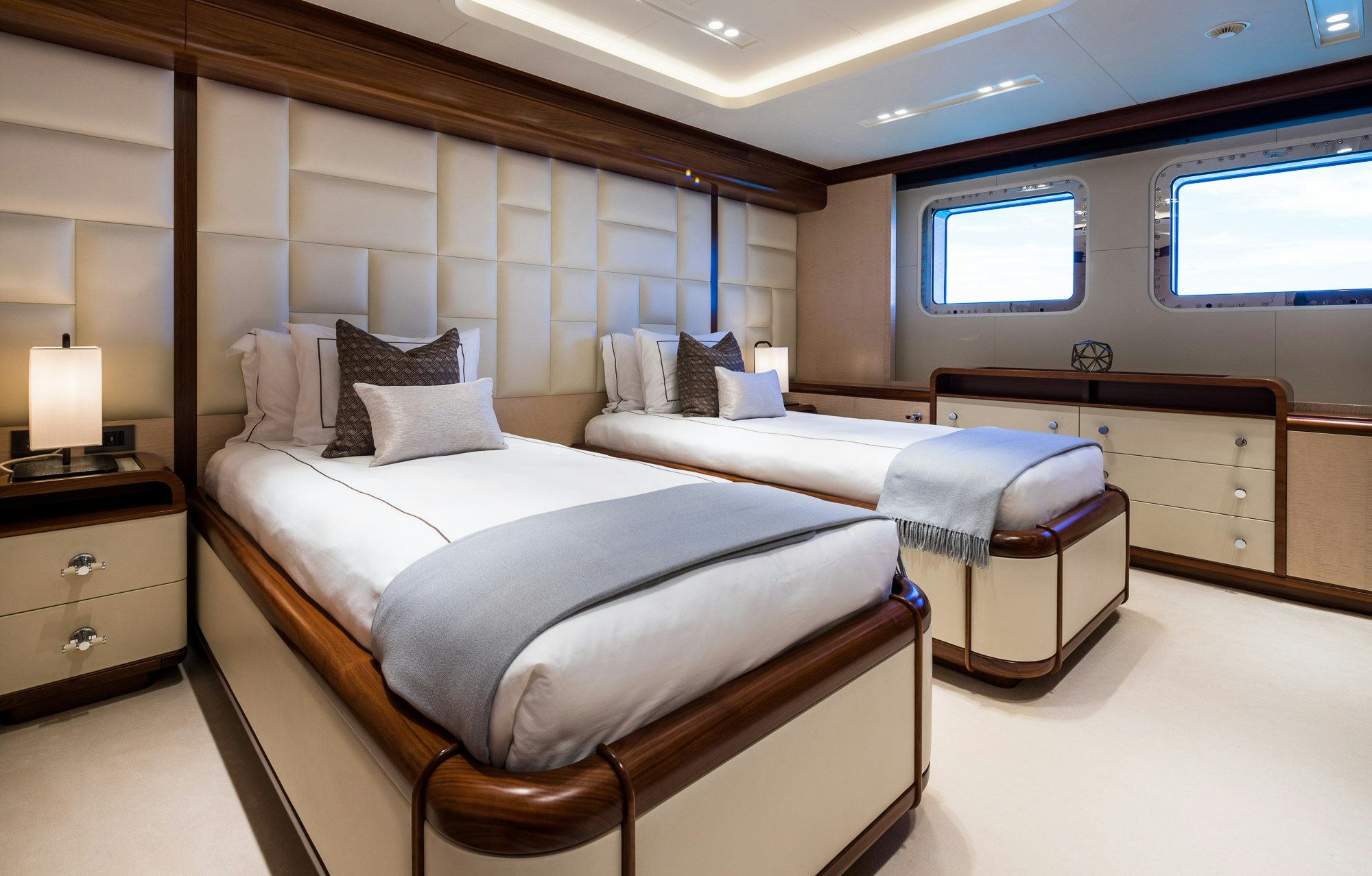 a couple of beds in a room aboard CALEX Yacht for Charter
