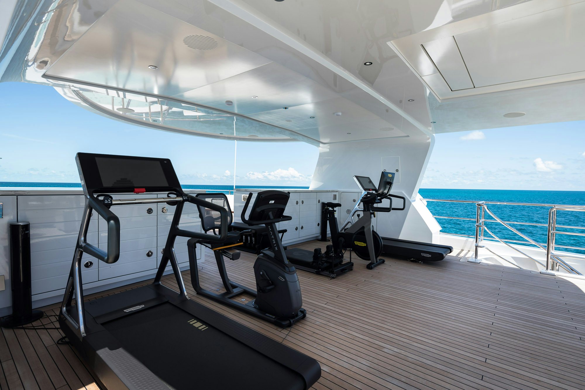 a treadmill in a room aboard CALEX Yacht for Charter