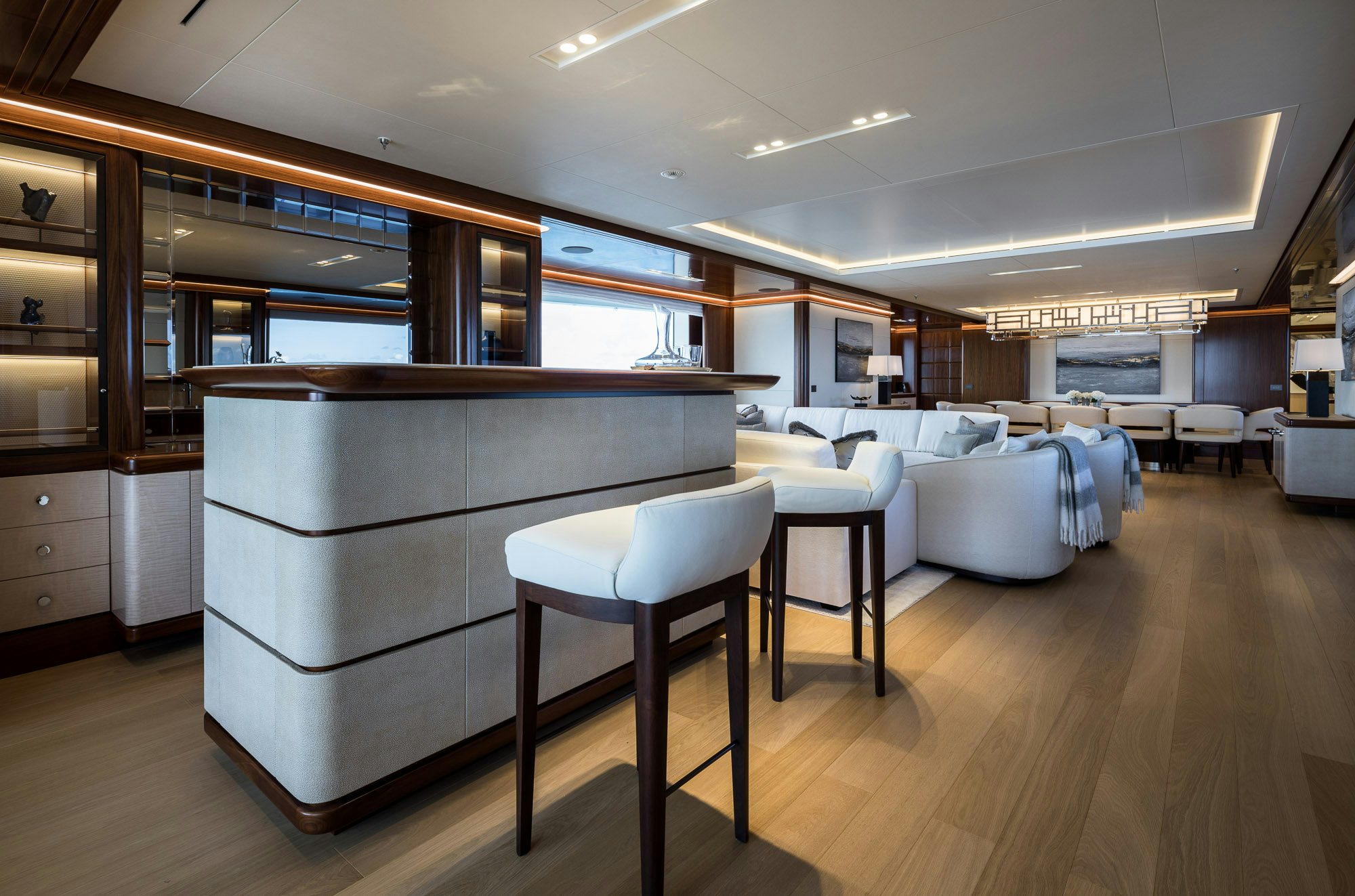 a large room with a desk and chairs aboard CALEX Yacht for Charter