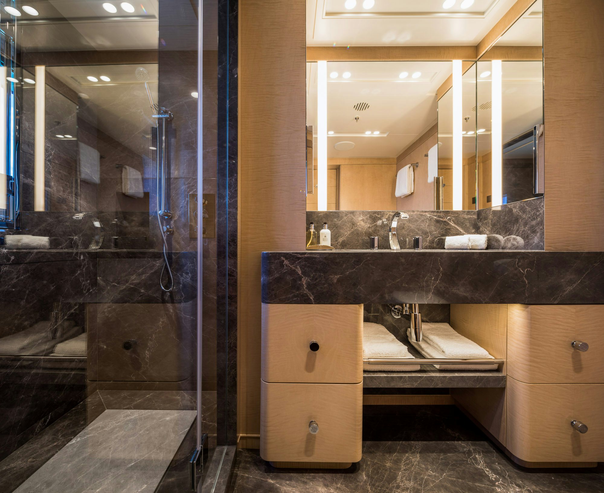 a bathroom with a large glass shower aboard CALEX Yacht for Charter