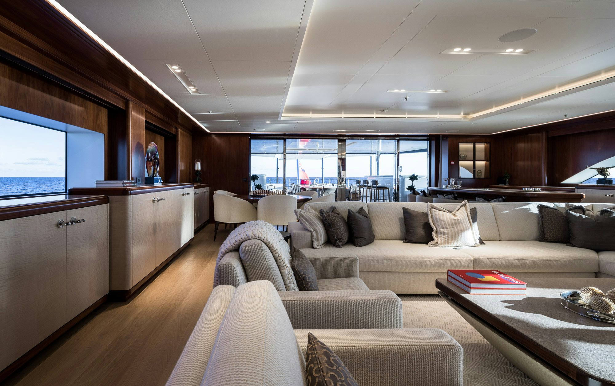 a living room with a couch and a table aboard CALEX Yacht for Charter