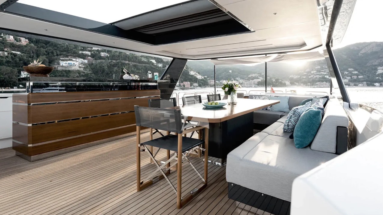 a room with a table and chairs aboard THEOTOKOS VI Yacht for Charter