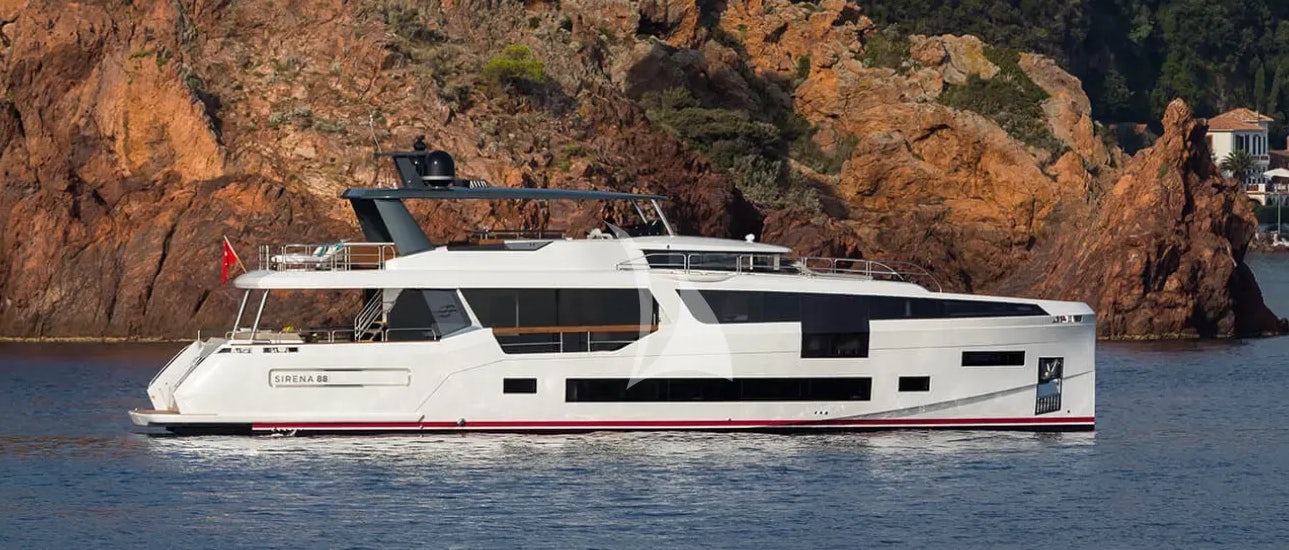 a white yacht on the water aboard THEOTOKOS VI Yacht for Charter