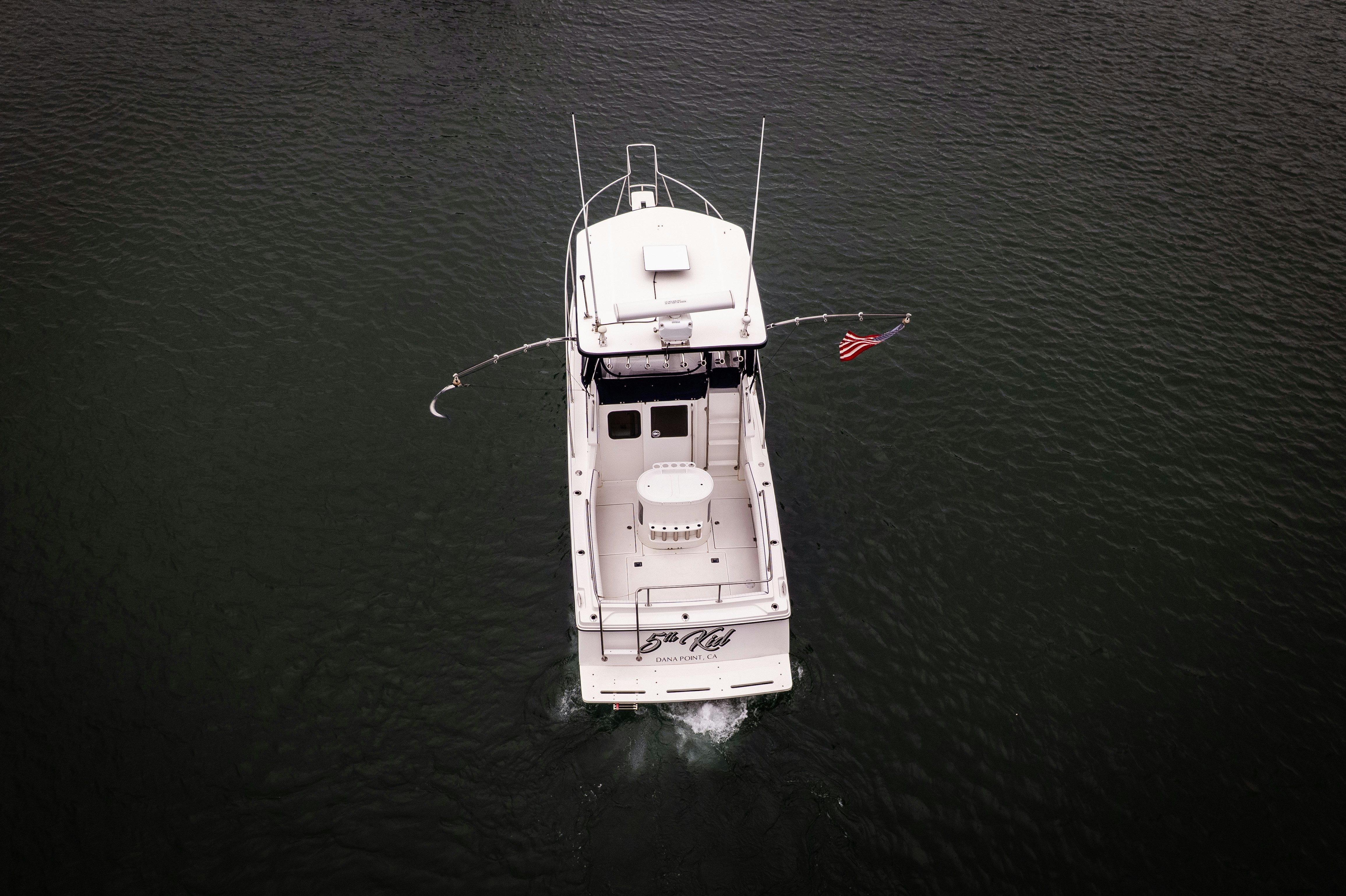 a white boat in the water aboard 5TH KID Yacht for Sale