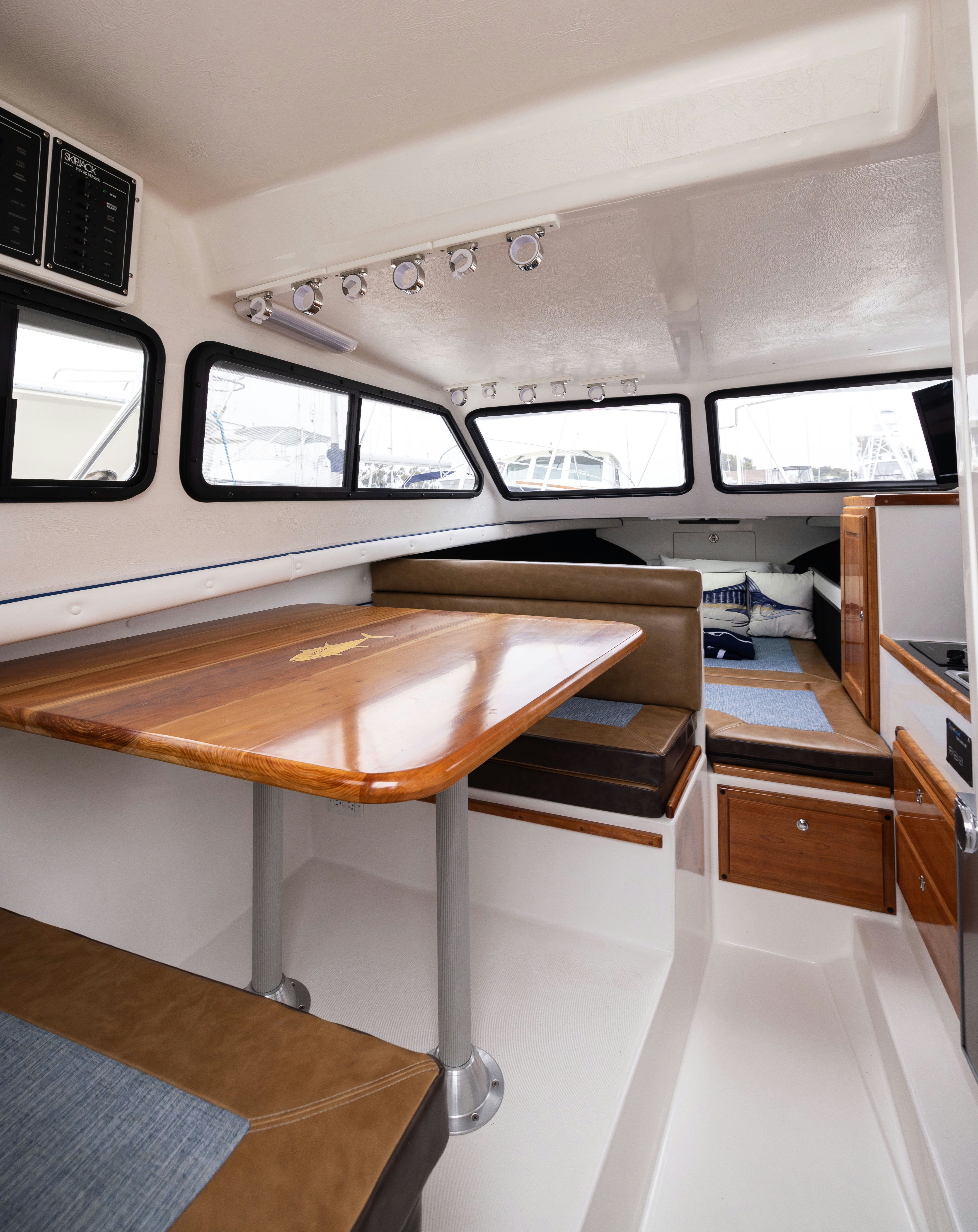 a room with a table and chairs aboard 5TH KID Yacht for Sale