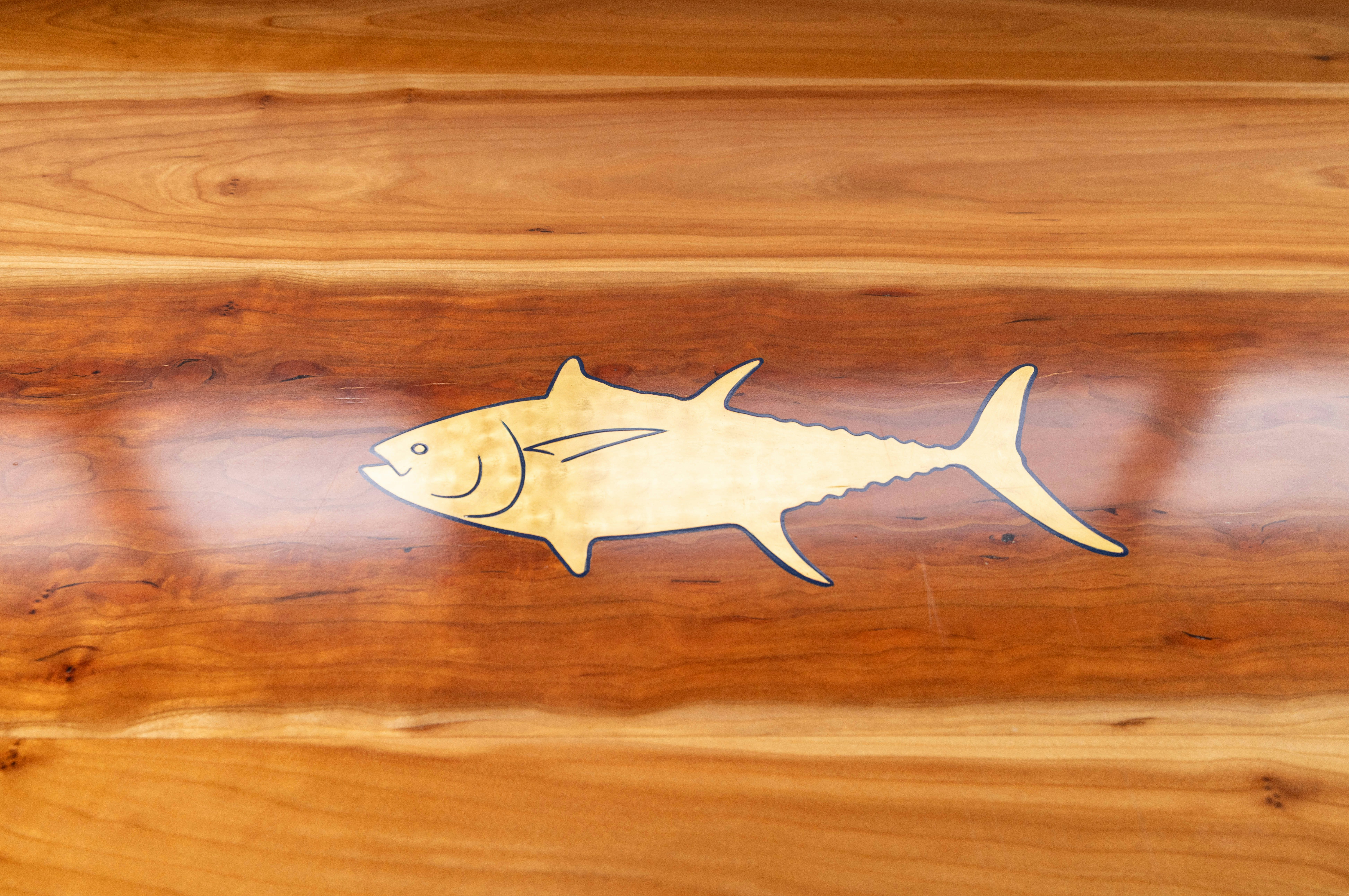 a white fish on a wood surface aboard 5TH KID Yacht for Sale