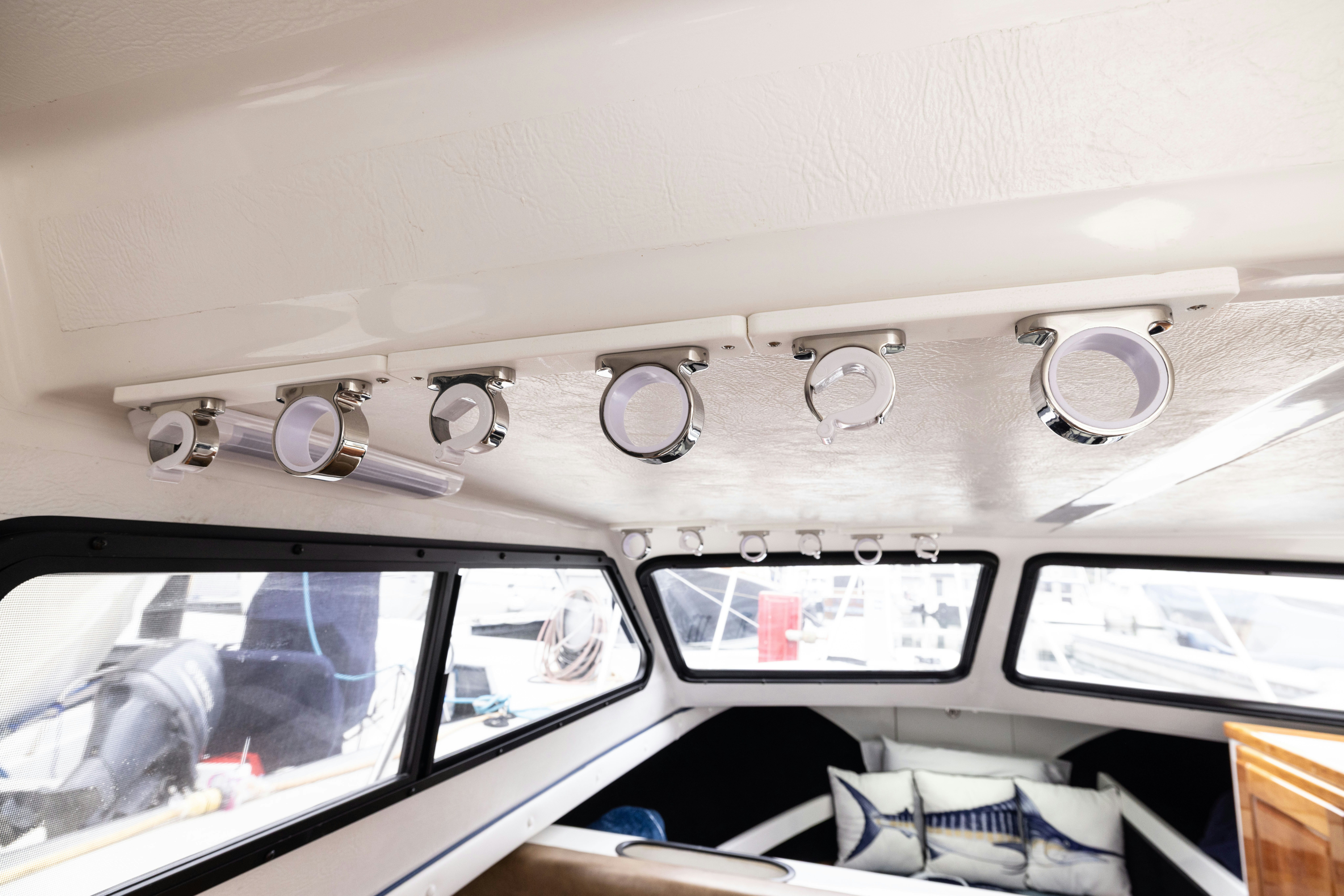 a white car with a silver plate aboard 5TH KID Yacht for Sale