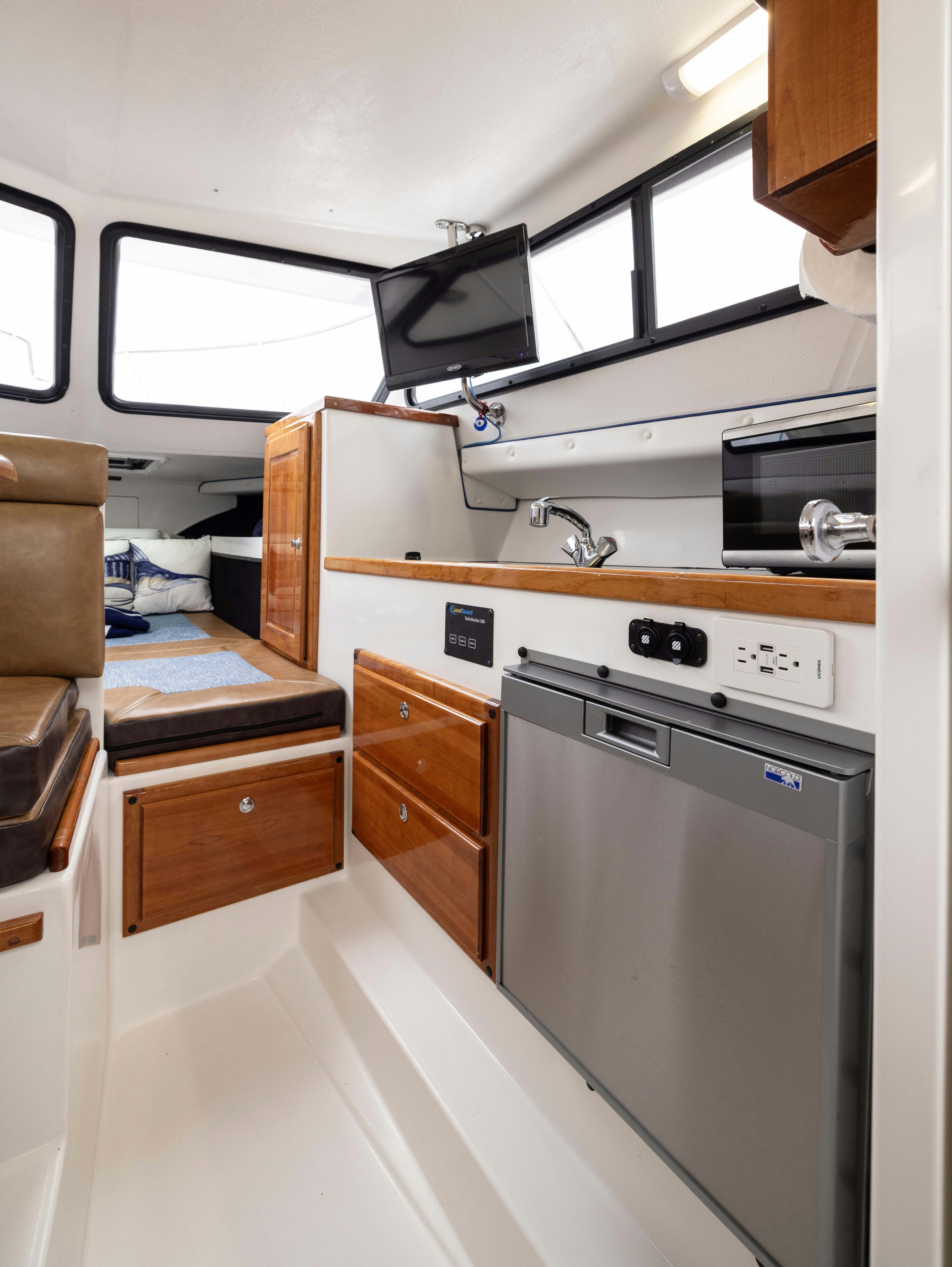 a kitchen with a microwave oven and a microwave aboard 5TH KID Yacht for Sale