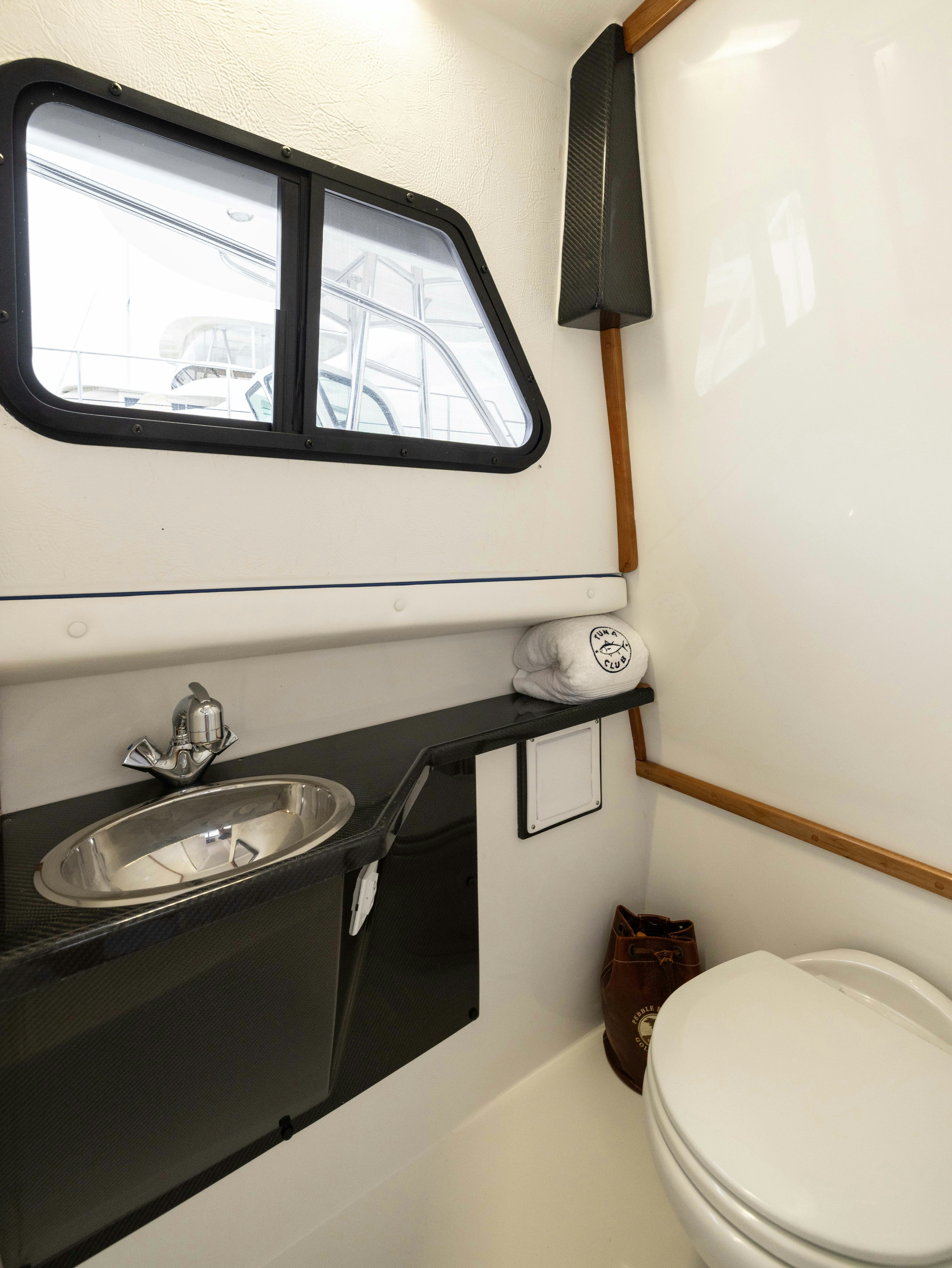 a bathroom with a sink and toilet aboard 5TH KID Yacht for Sale