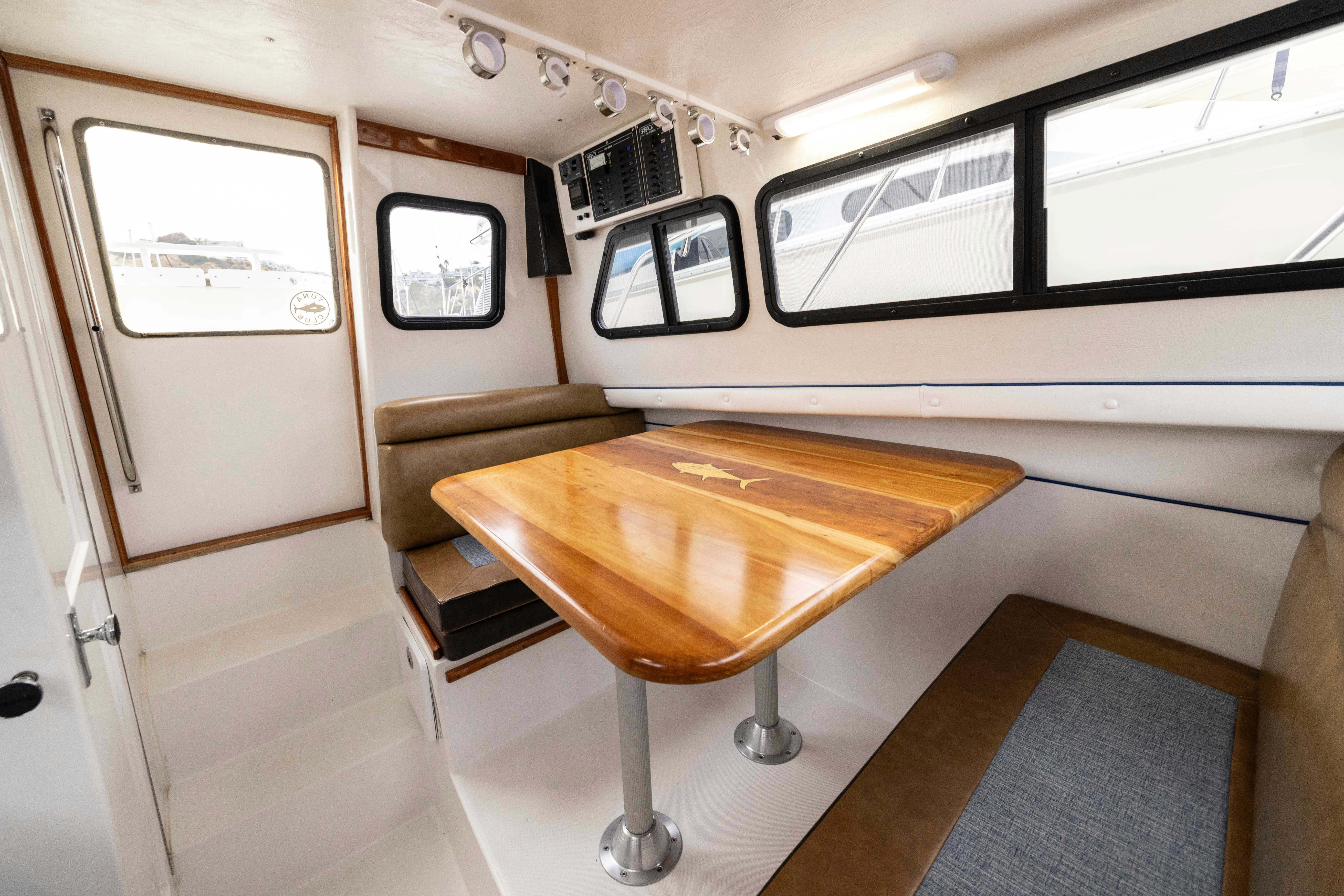 a table in a room aboard 5TH KID Yacht for Sale