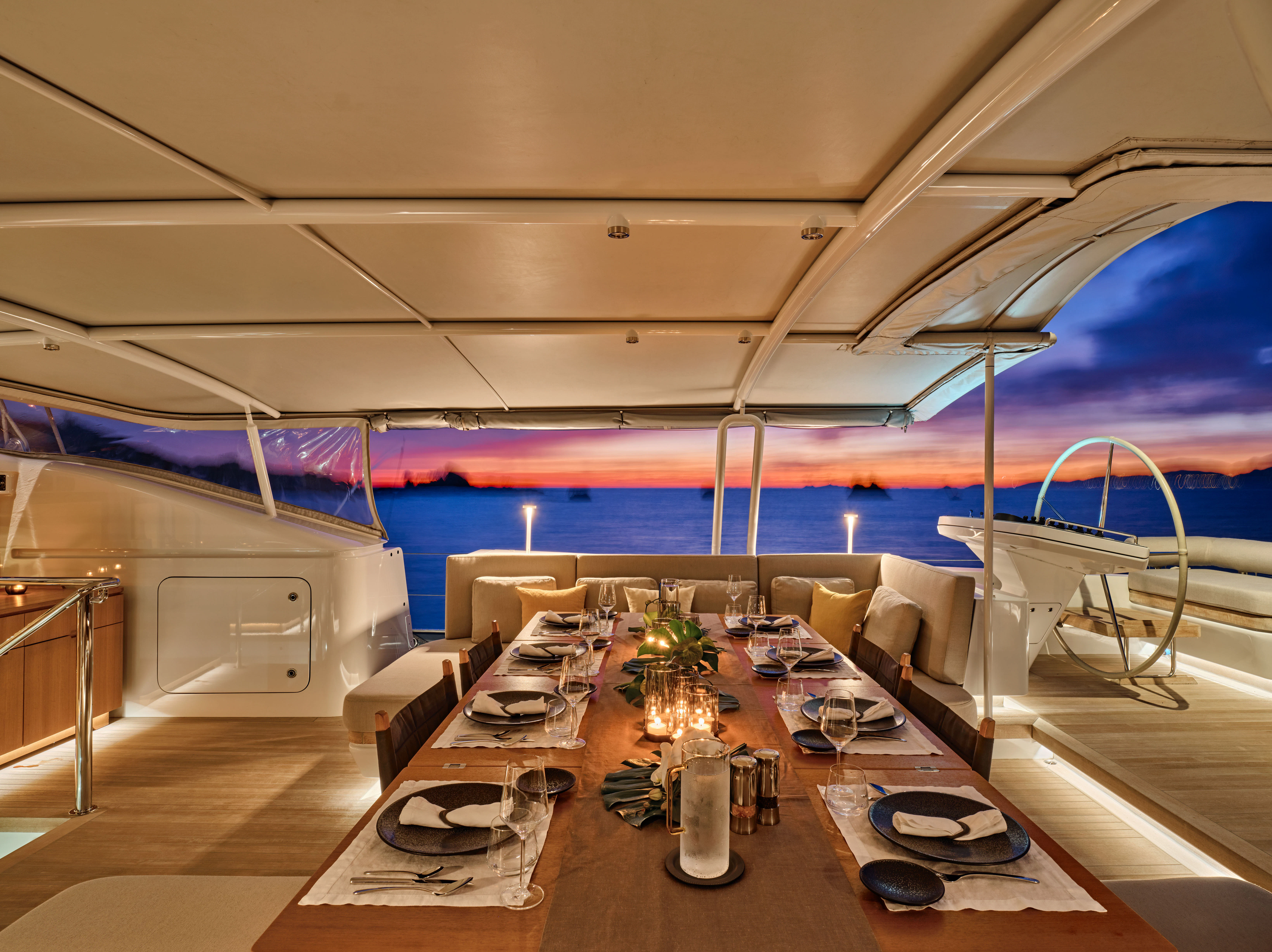 a room with tables and chairs aboard GUILLEMOT Yacht for Charter