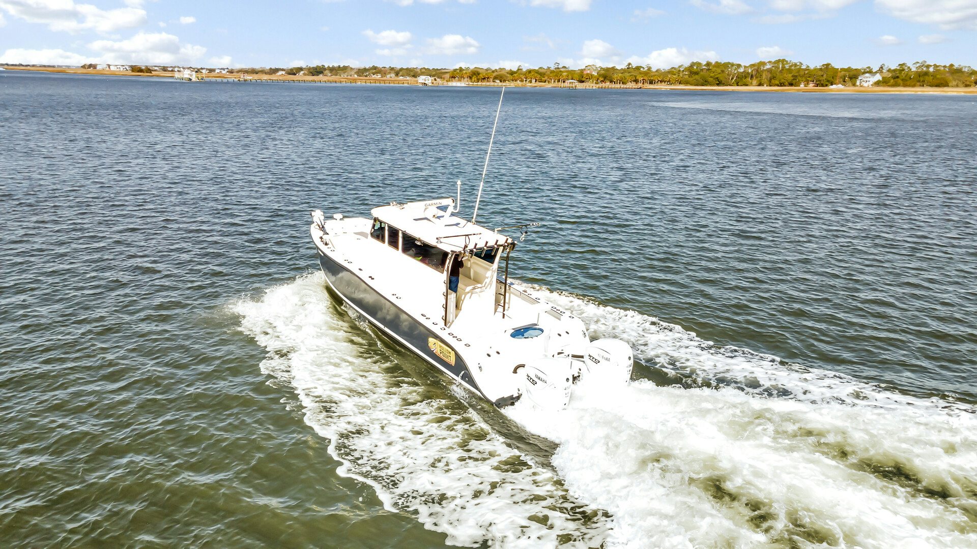 a boat on the water aboard OUR TRADE Yacht for Sale