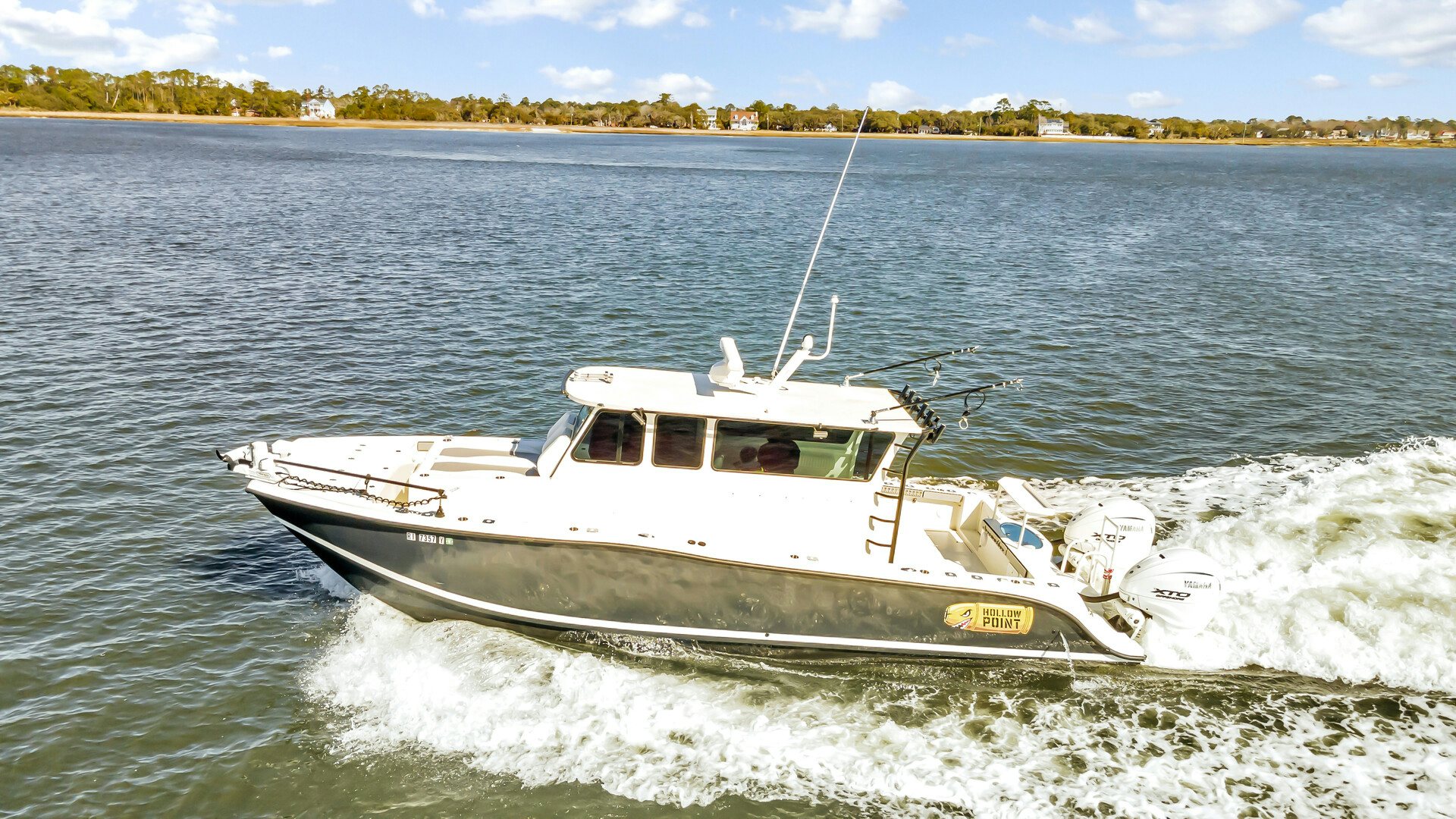 a boat on the water aboard OUR TRADE Yacht for Sale