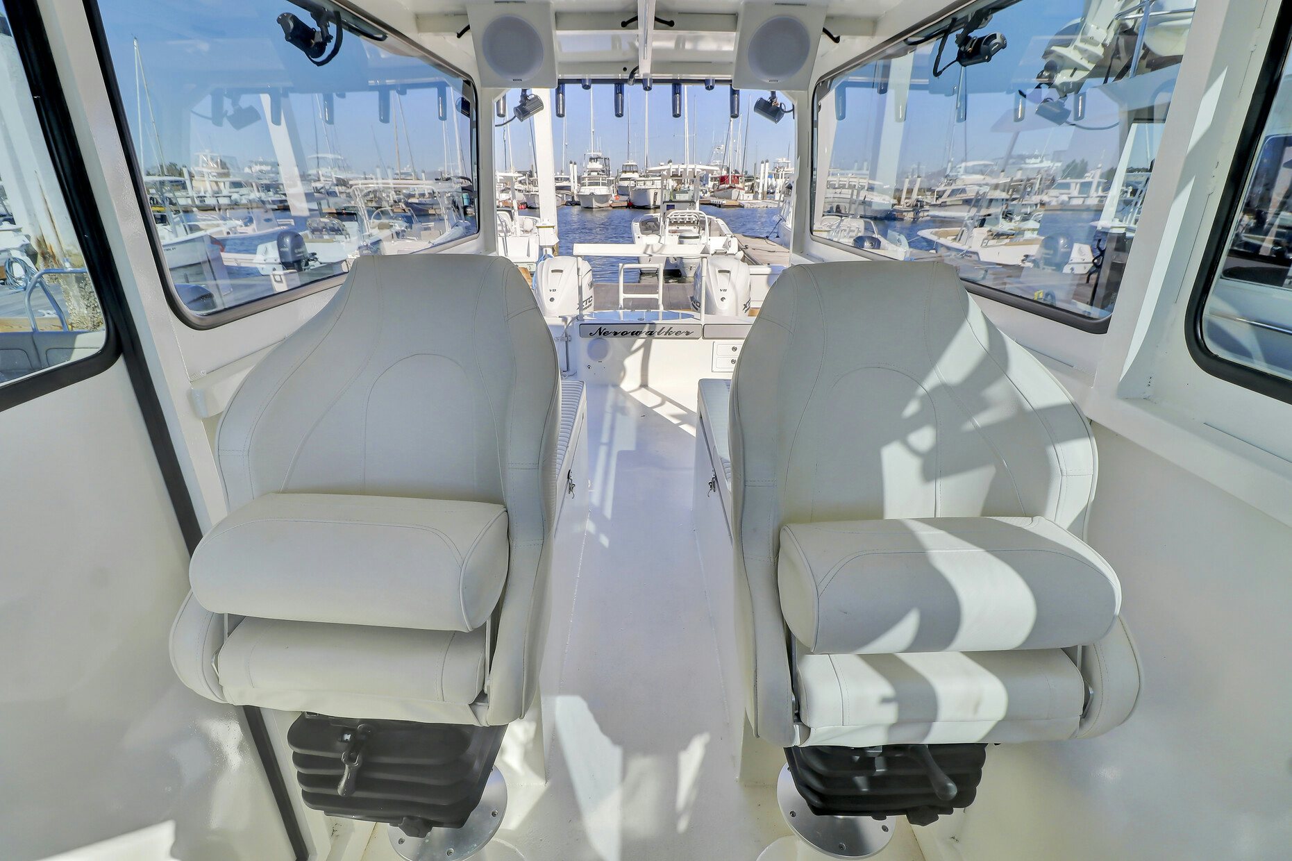 a room with chairs and computers aboard OUR TRADE Yacht for Sale
