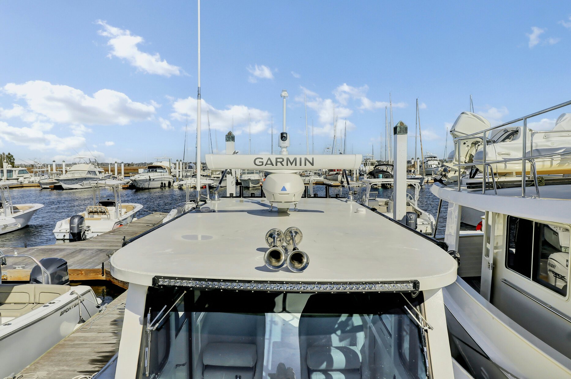 a large ship in a harbor aboard OUR TRADE Yacht for Sale