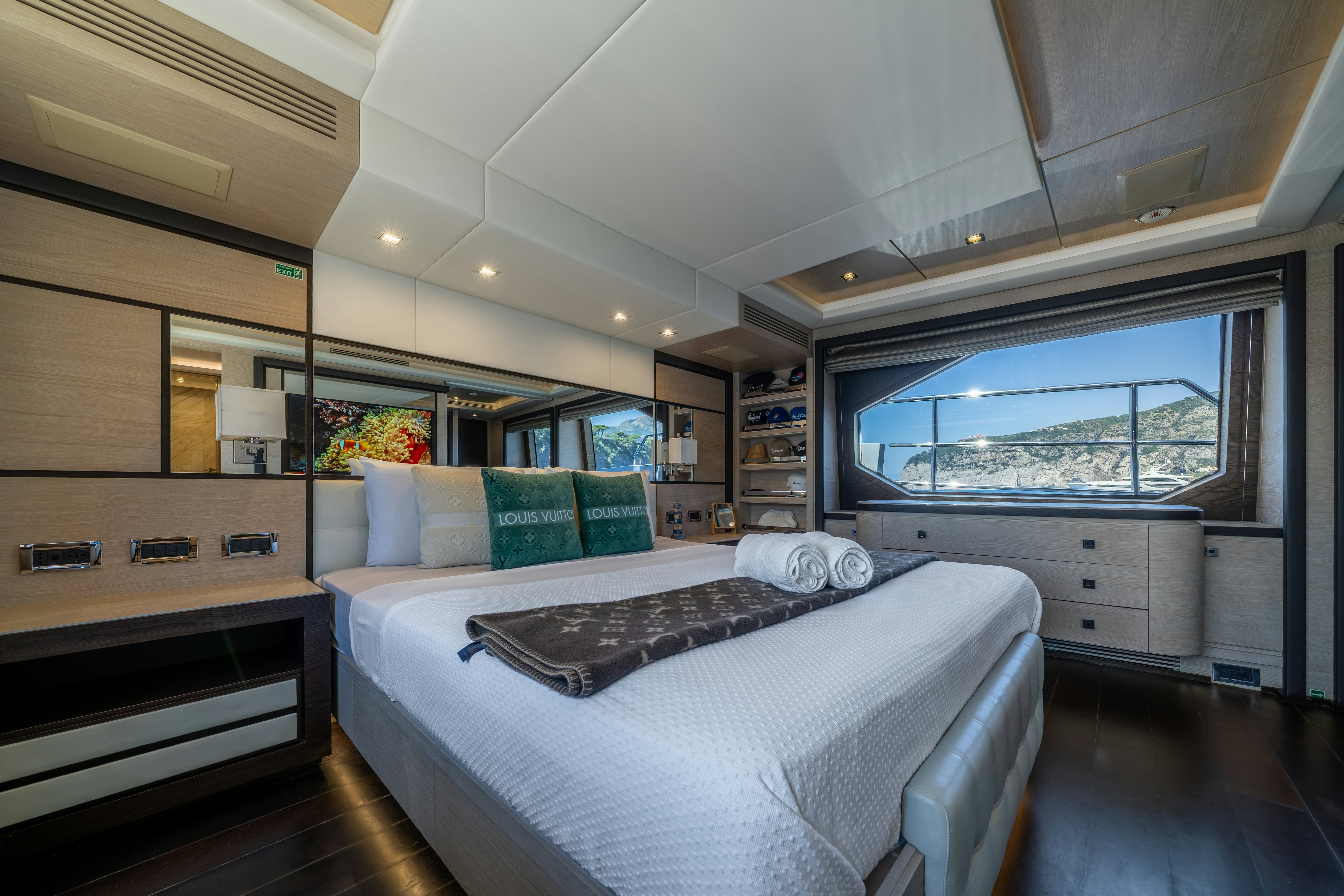 a bedroom with a large bed aboard HORIZON Yacht for Sale