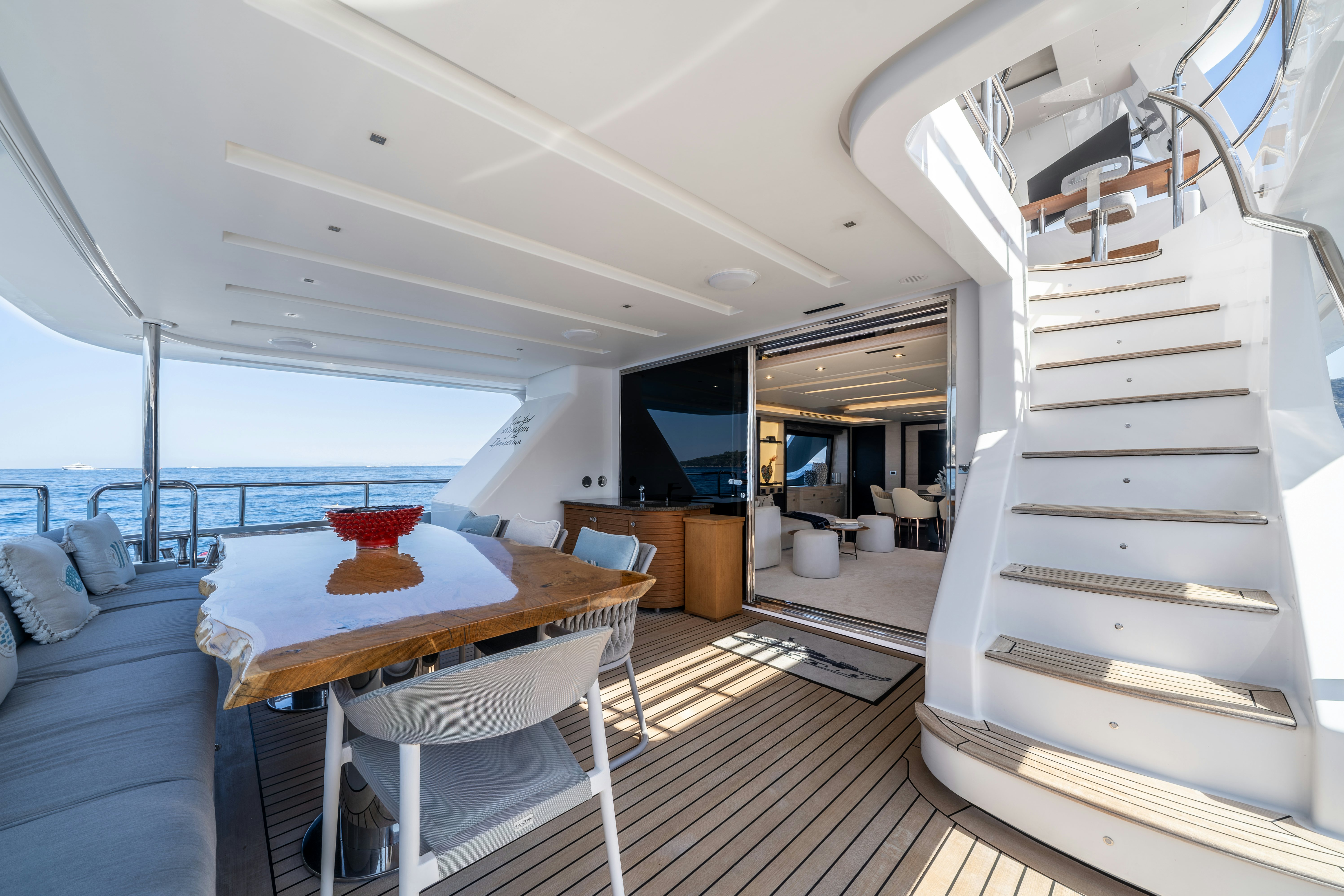 a room with a table and chairs aboard HORIZON Yacht for Sale