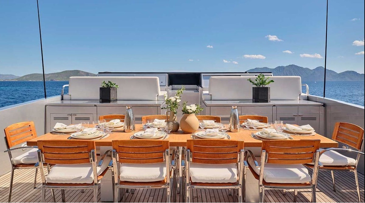 a table set for a meal aboard AMICI PER SEMPRE Yacht for Charter