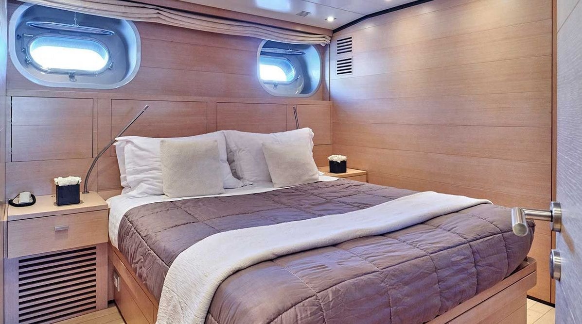a bed in a room aboard AMICI PER SEMPRE Yacht for Charter