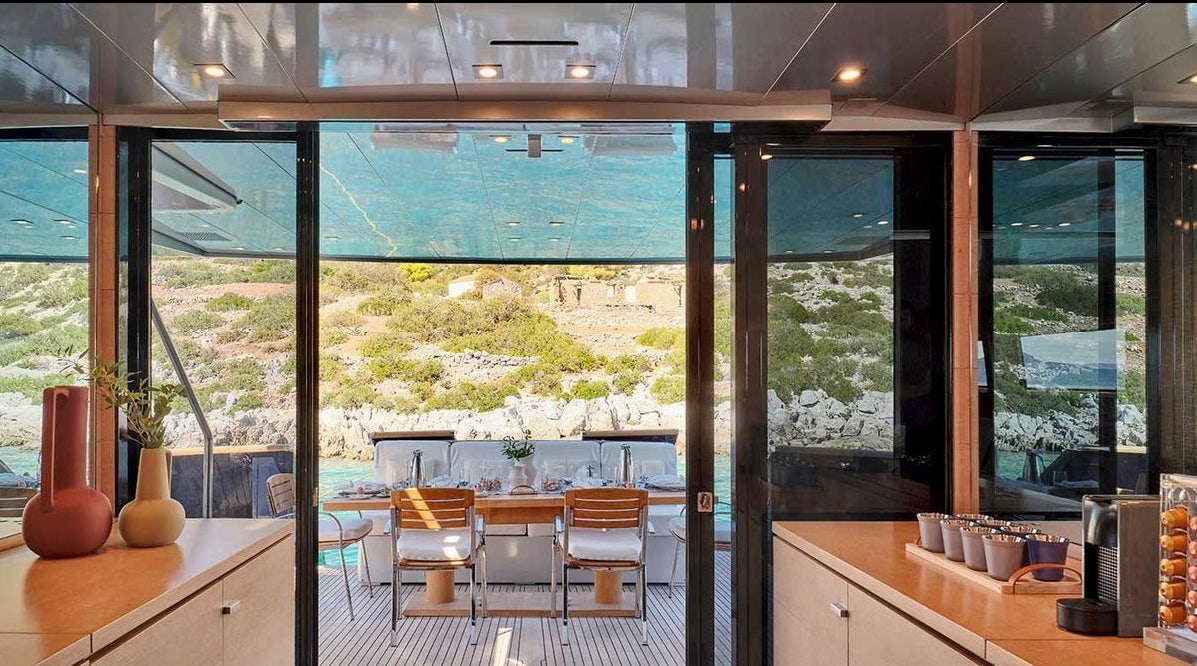 a room with a large window aboard AMICI PER SEMPRE Yacht for Charter