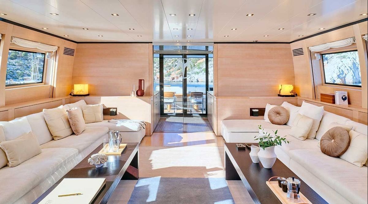 a living room with a large window aboard AMICI PER SEMPRE Yacht for Charter