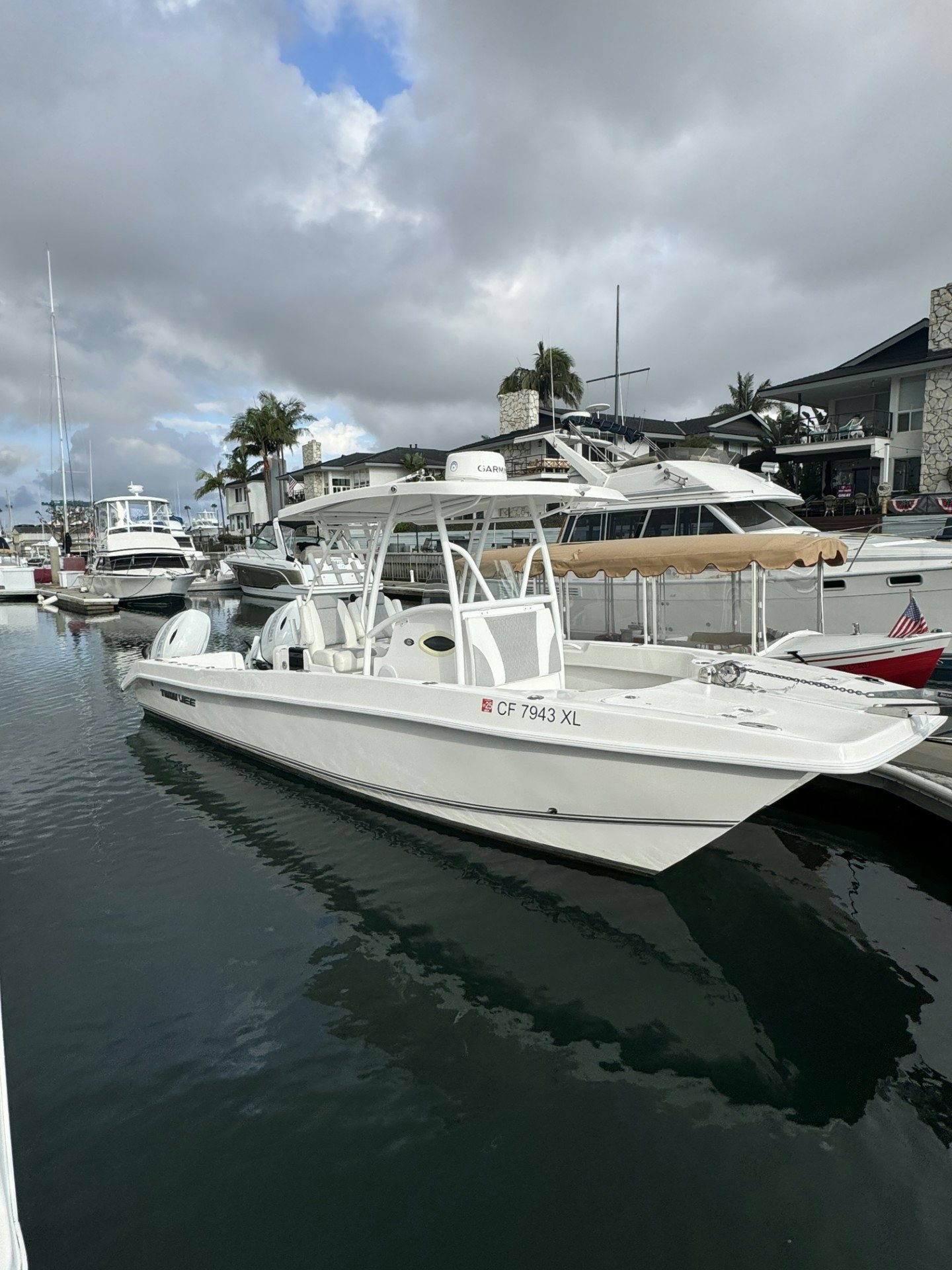 a group of boats are parked in a harbor aboard TWIN VEE 26 Yacht for Sale