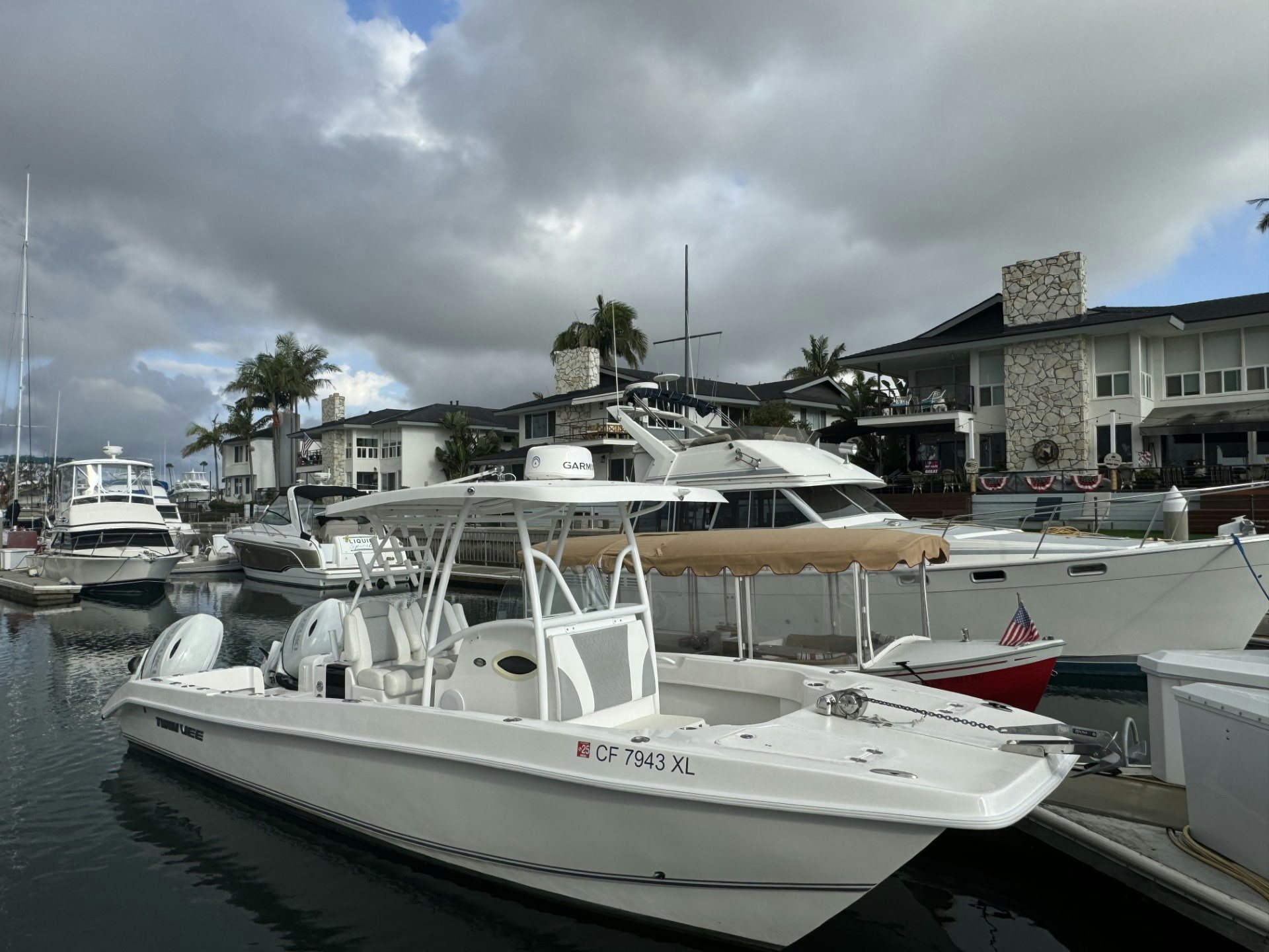 a group of boats are parked in a harbor aboard TWIN VEE 26 Yacht for Sale