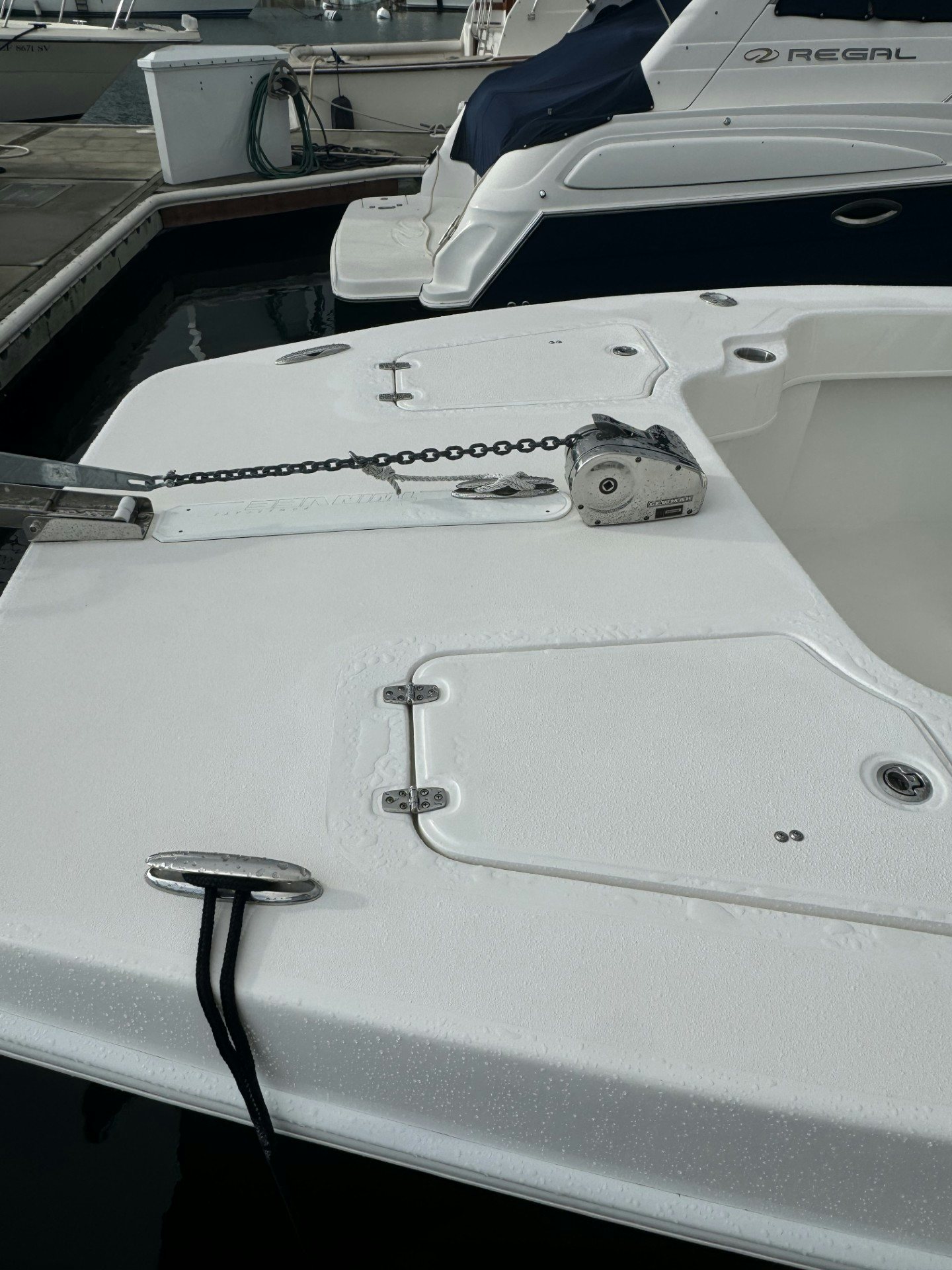a white car with a hood aboard TWIN VEE 26 Yacht for Sale