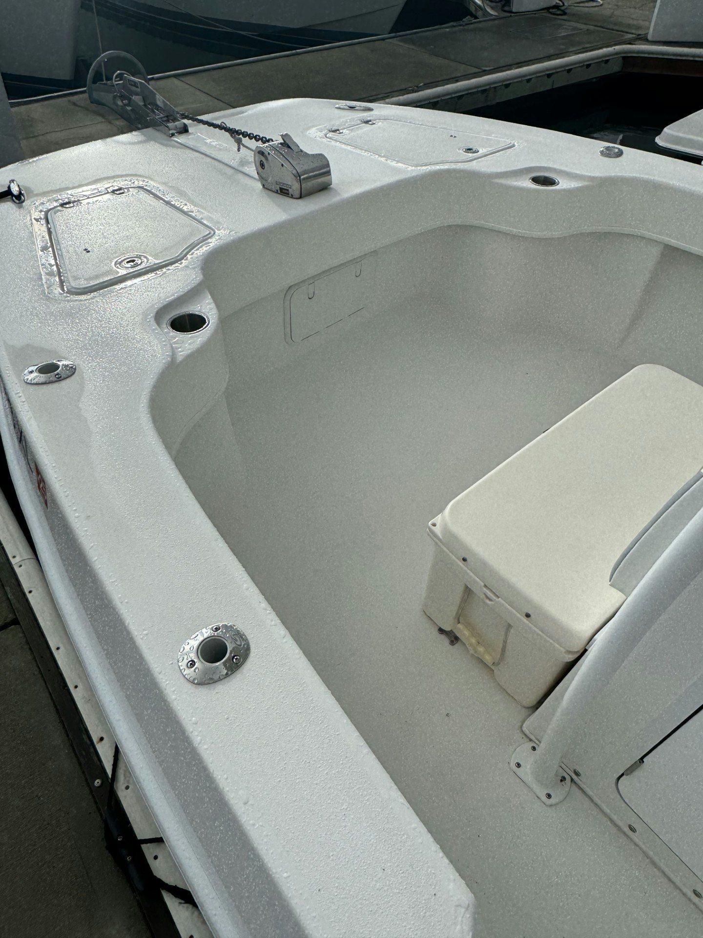a white sink with a faucet aboard TWIN VEE 26 Yacht for Sale
