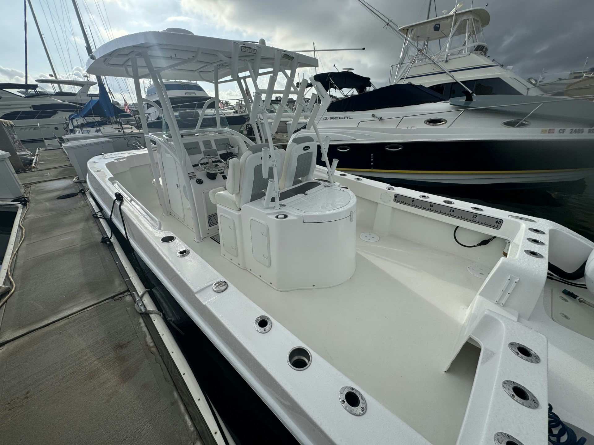 a row of white yachts aboard TWIN VEE 26 Yacht for Sale