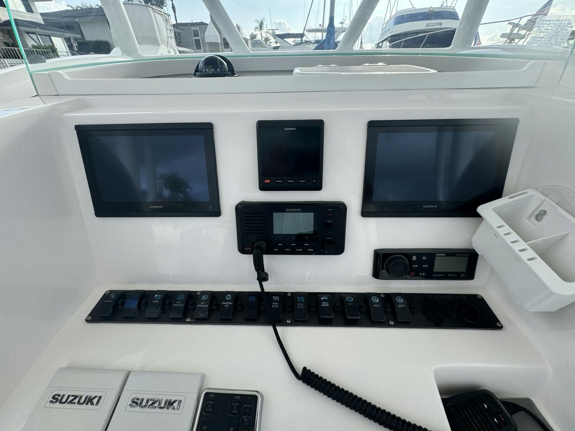 a white vehicle with a black keyboard aboard TWIN VEE 26 Yacht for Sale