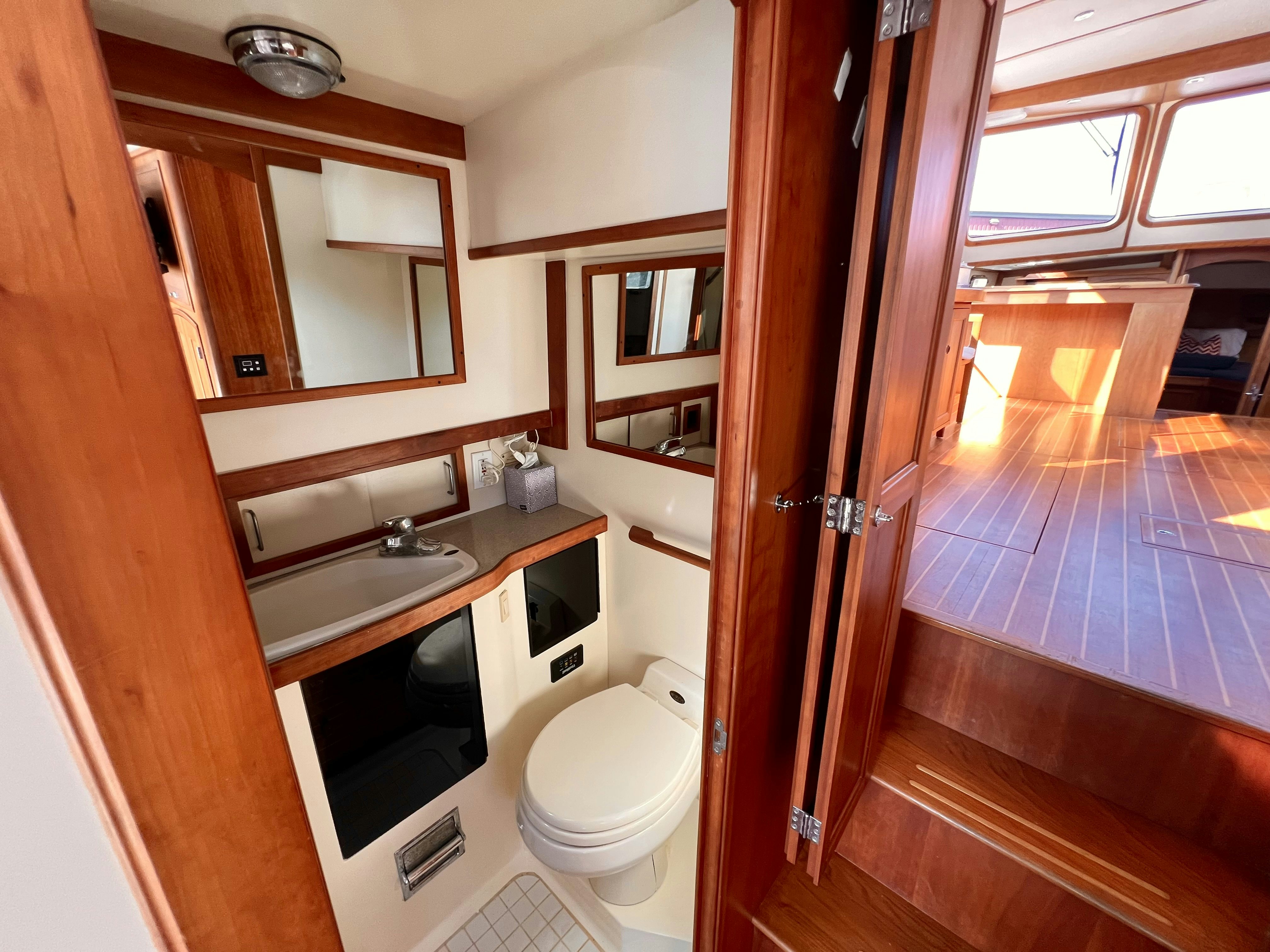 a bathroom with a sink and a toilet aboard SWAMP FOX Yacht for Sale