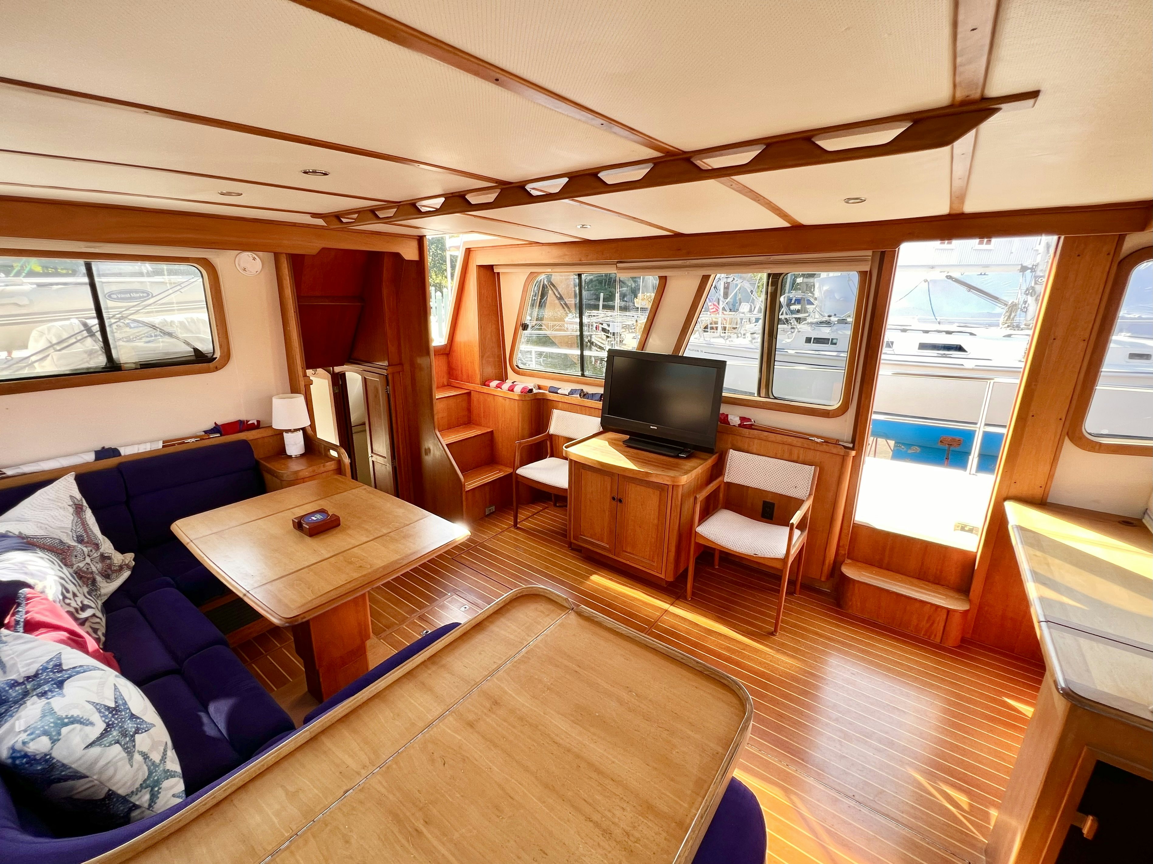 a living room with a couch and a tv aboard SWAMP FOX Yacht for Sale
