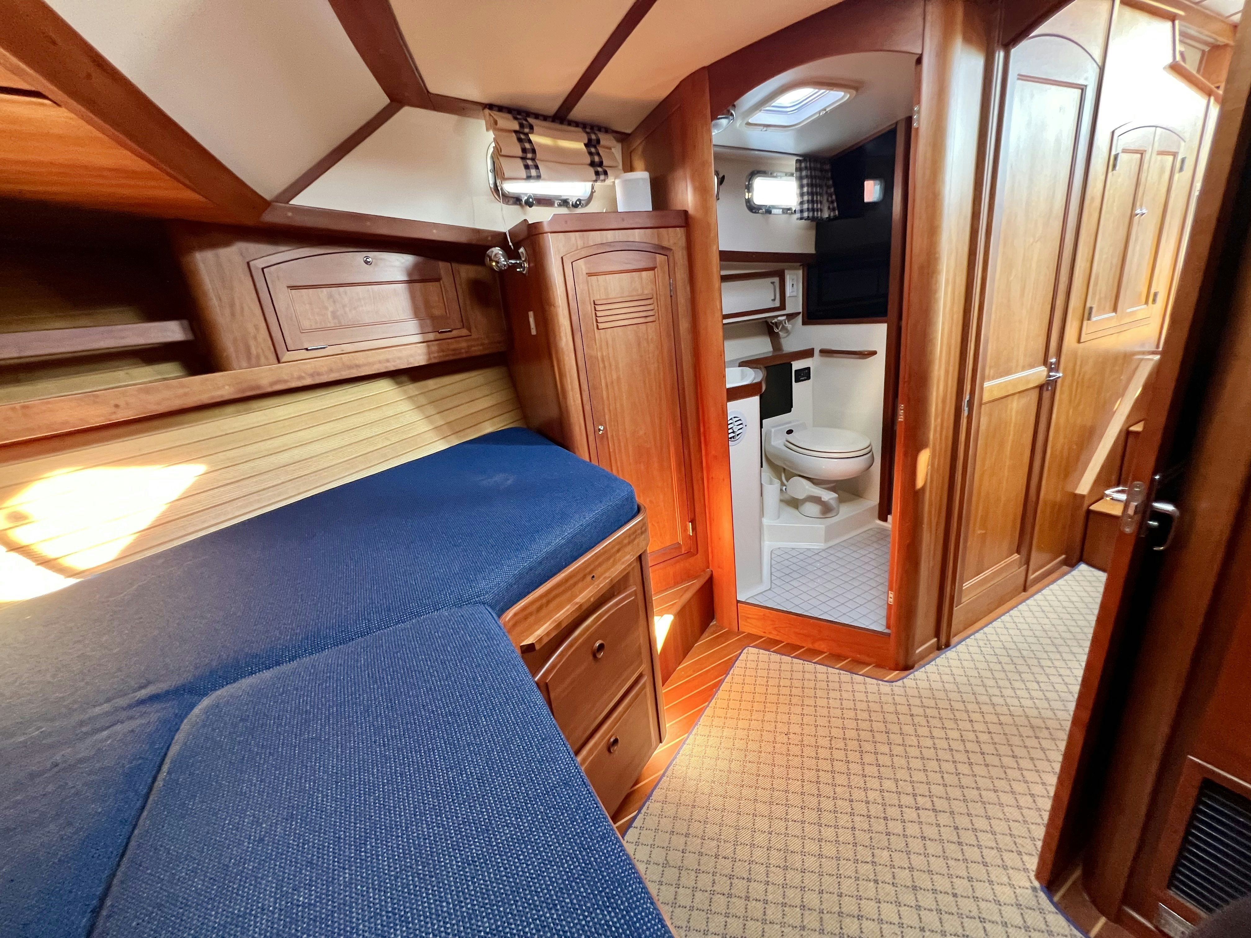 a small bathroom with a bunk bed aboard SWAMP FOX Yacht for Sale