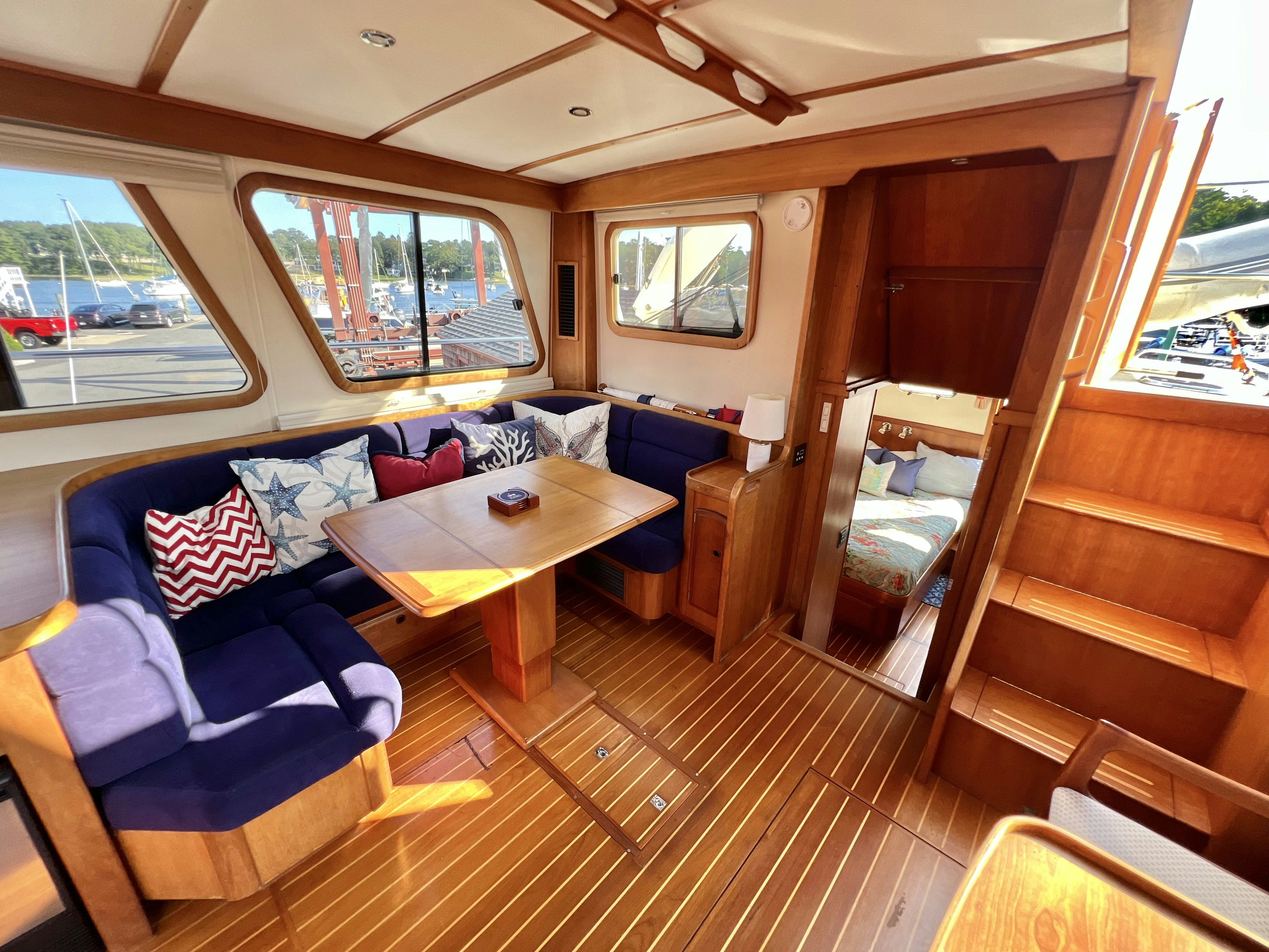 a cabin with a table and chairs aboard SWAMP FOX Yacht for Sale