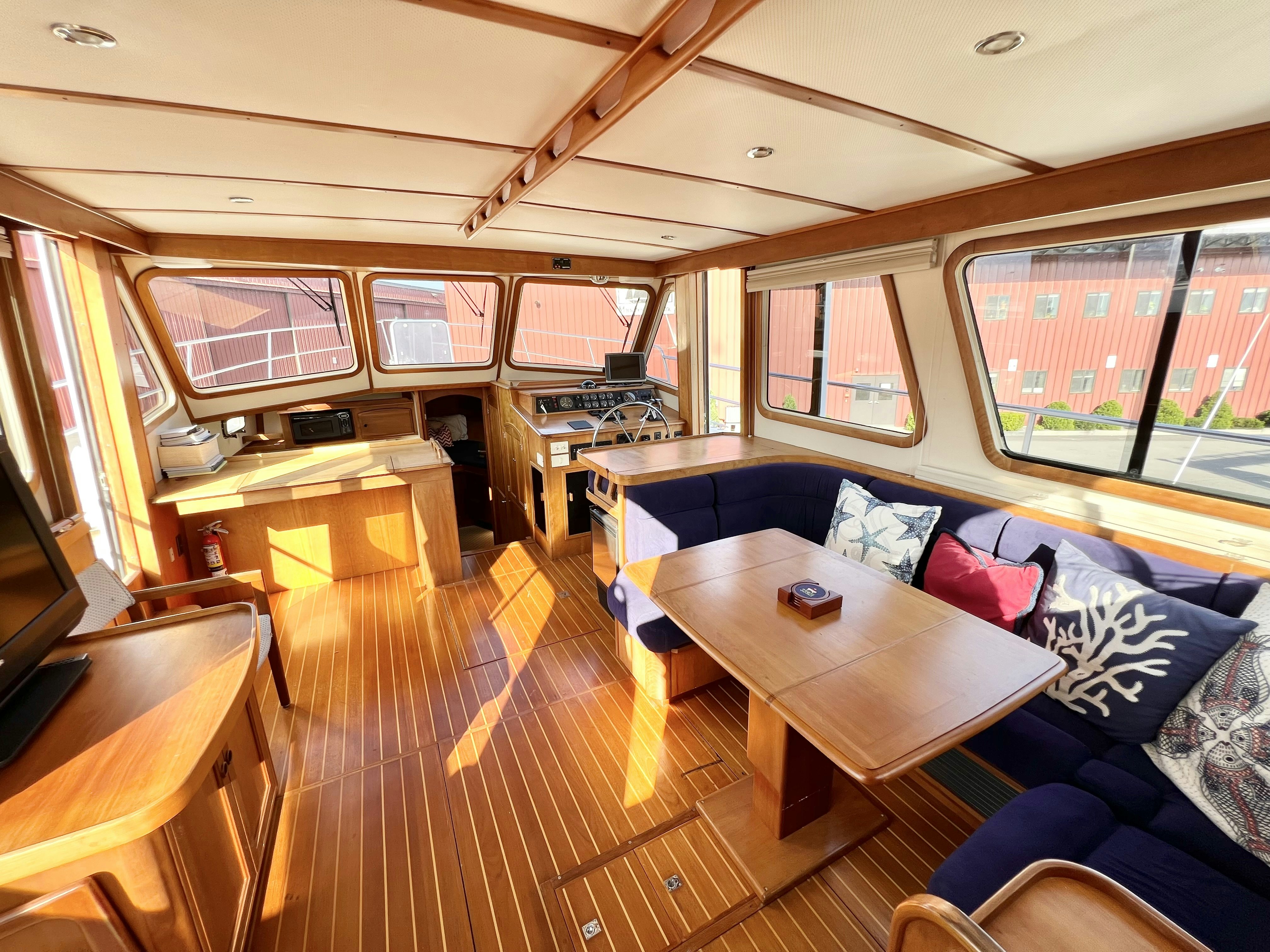 a room with a couch and a table aboard SWAMP FOX Yacht for Sale