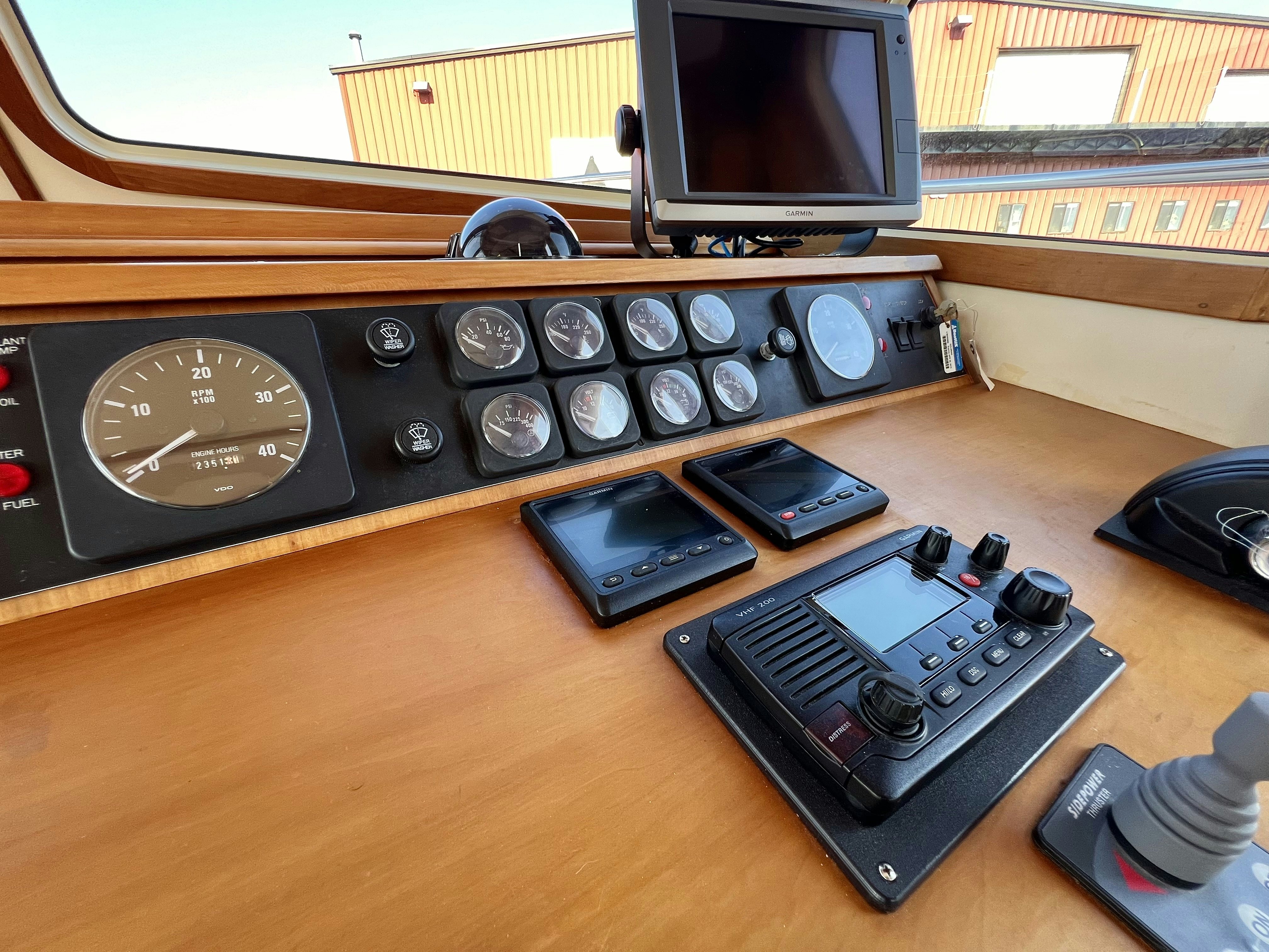 a group of electronic devices on a table aboard SWAMP FOX Yacht for Sale